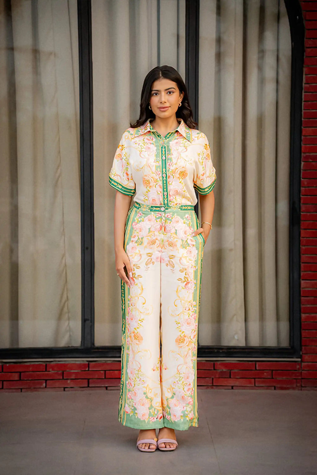 Woman wearing floral green border co-ord set front view