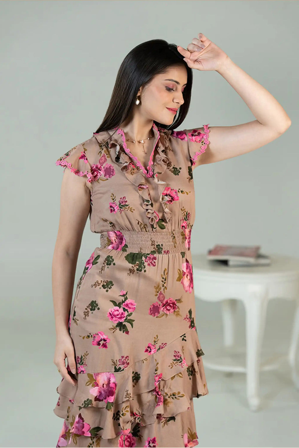 front view of floral ruffle midi dress with pink roses and frills