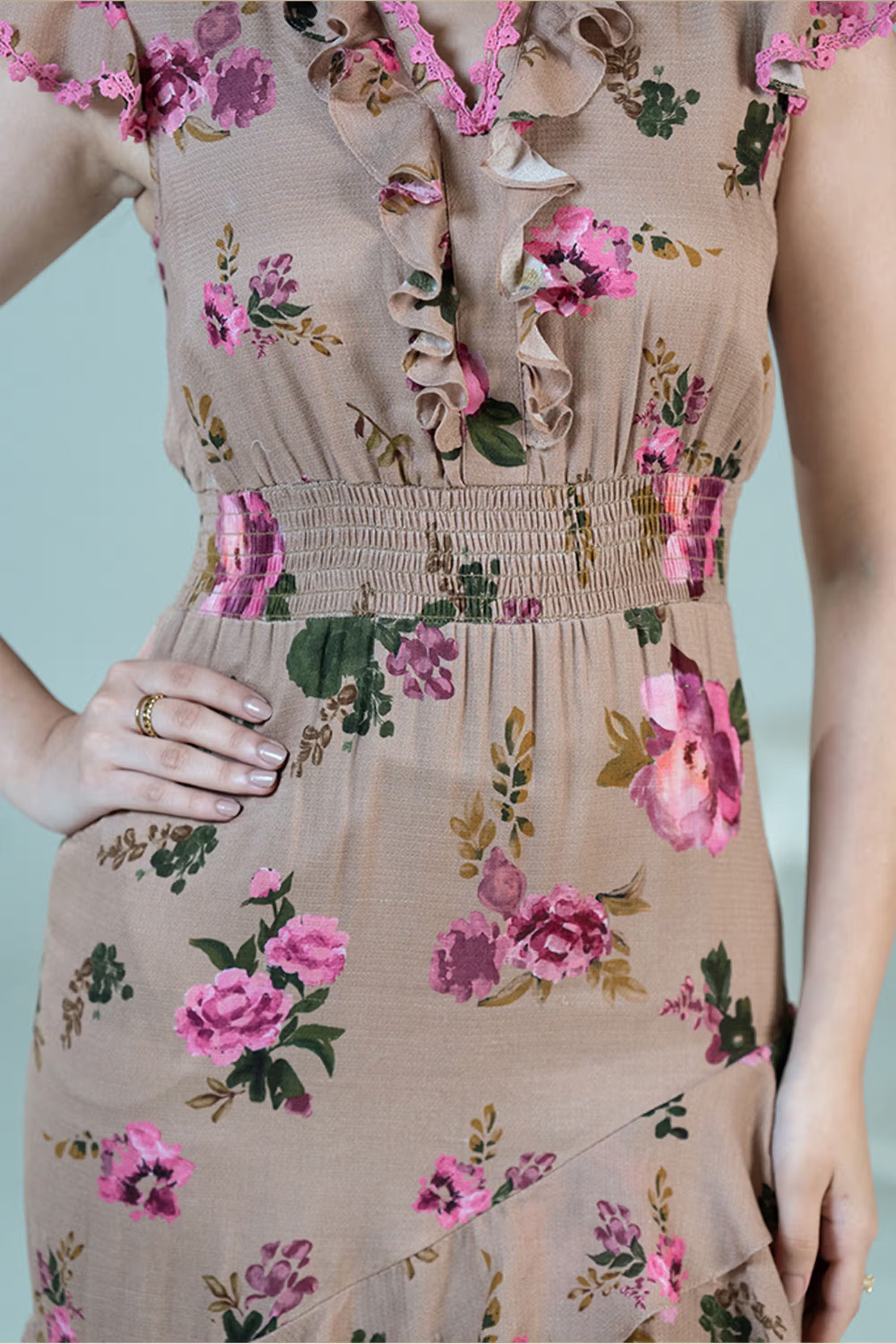 Smocked waist detail on beige ruffle midi dress with pink floral prints