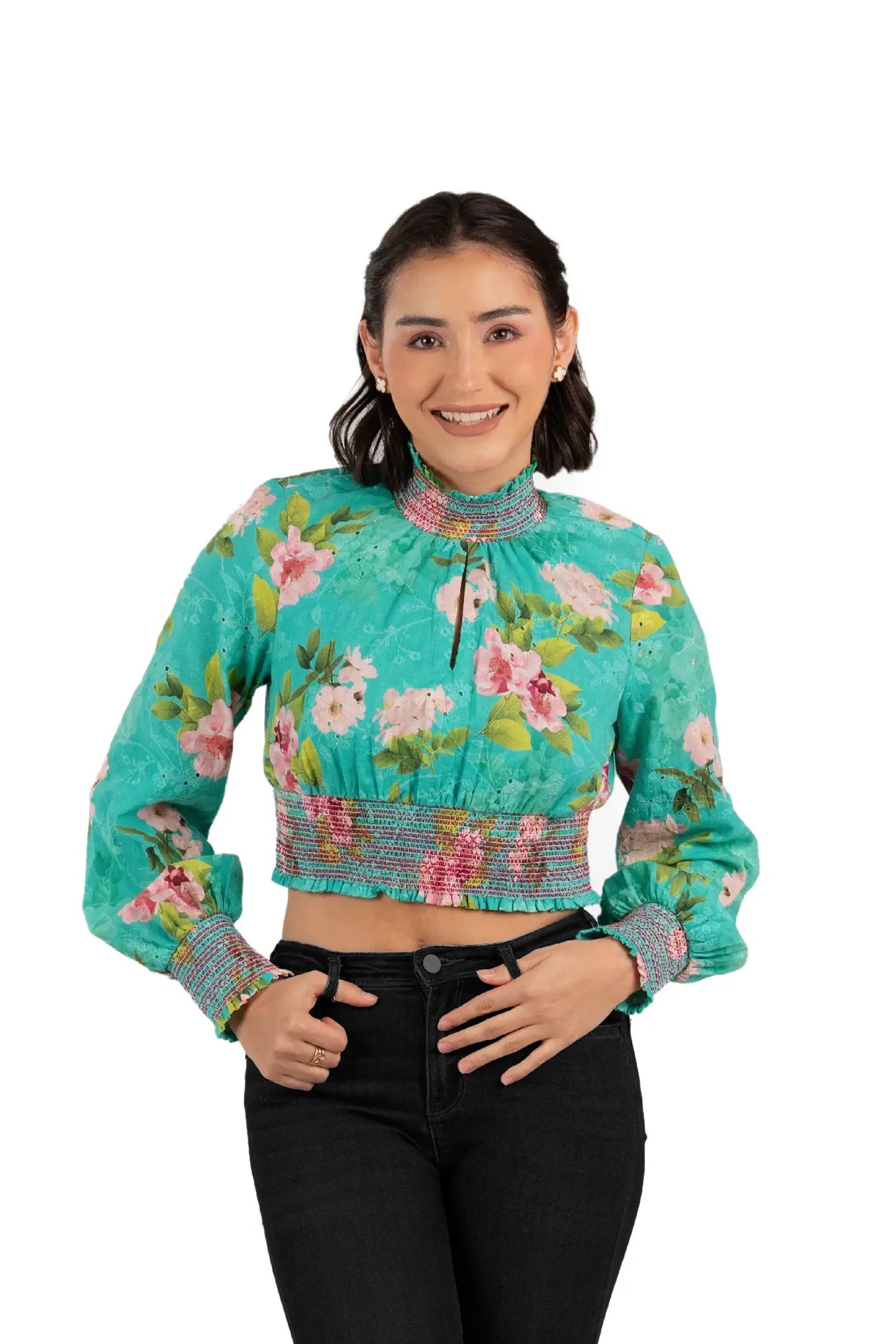 Front view of woman wearing green floral smocked crop top with full sleeves, stylish casual fashion