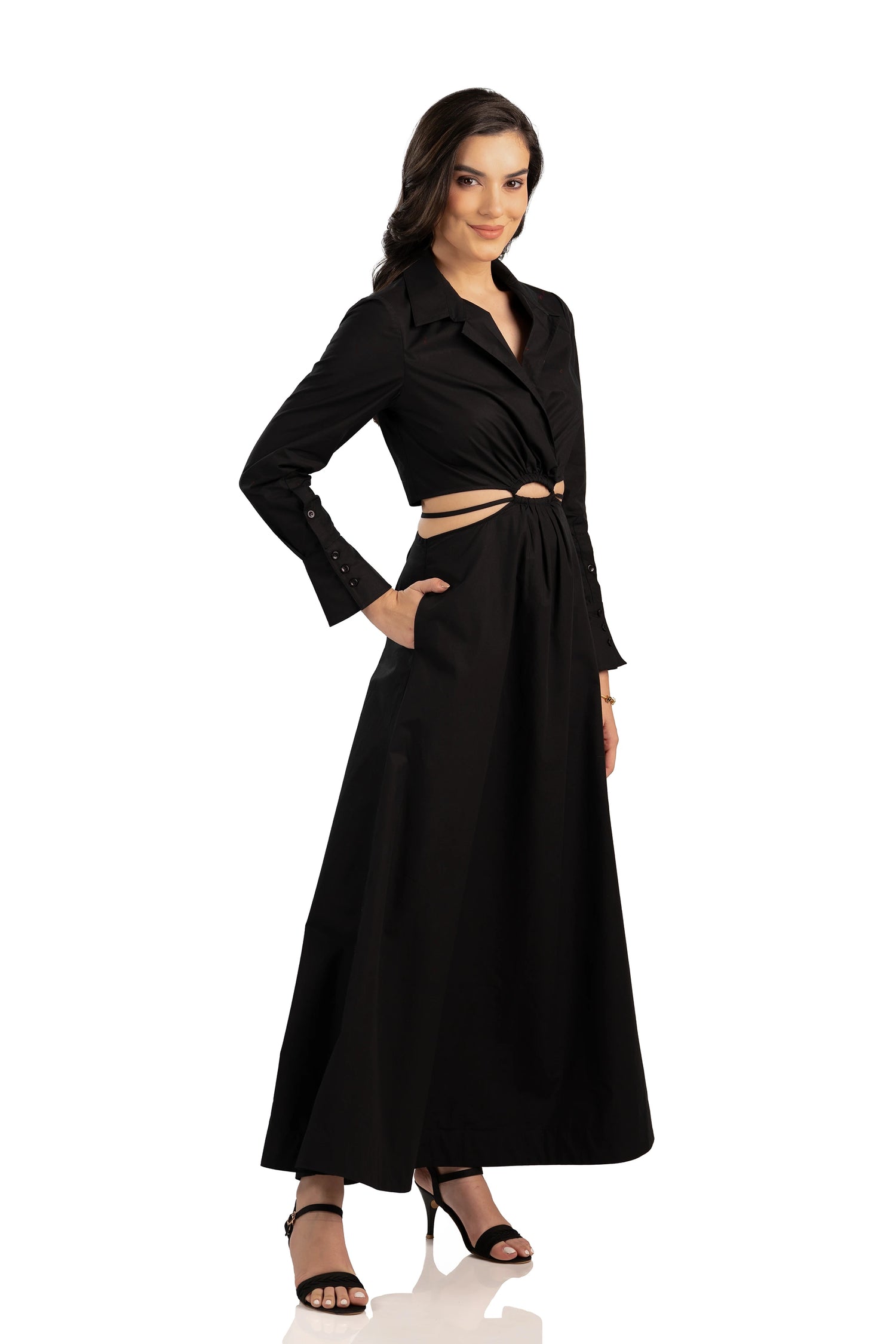 black maxi dress with cutout waist, long sleeves, and collared neckline.