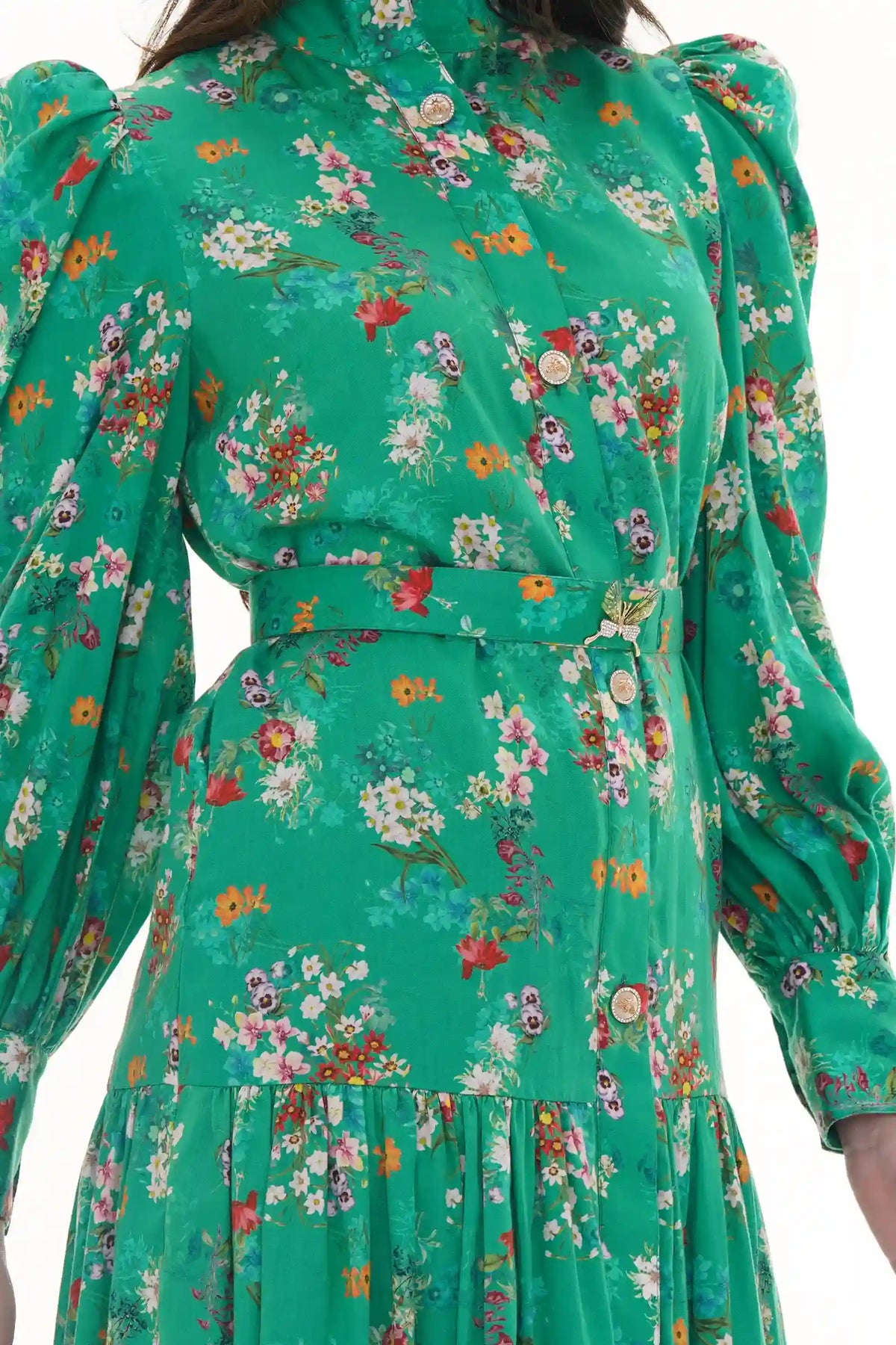 Woman in Pretty Pixie green floral high-neck belted shirt dress with butterfly brooch, back detail