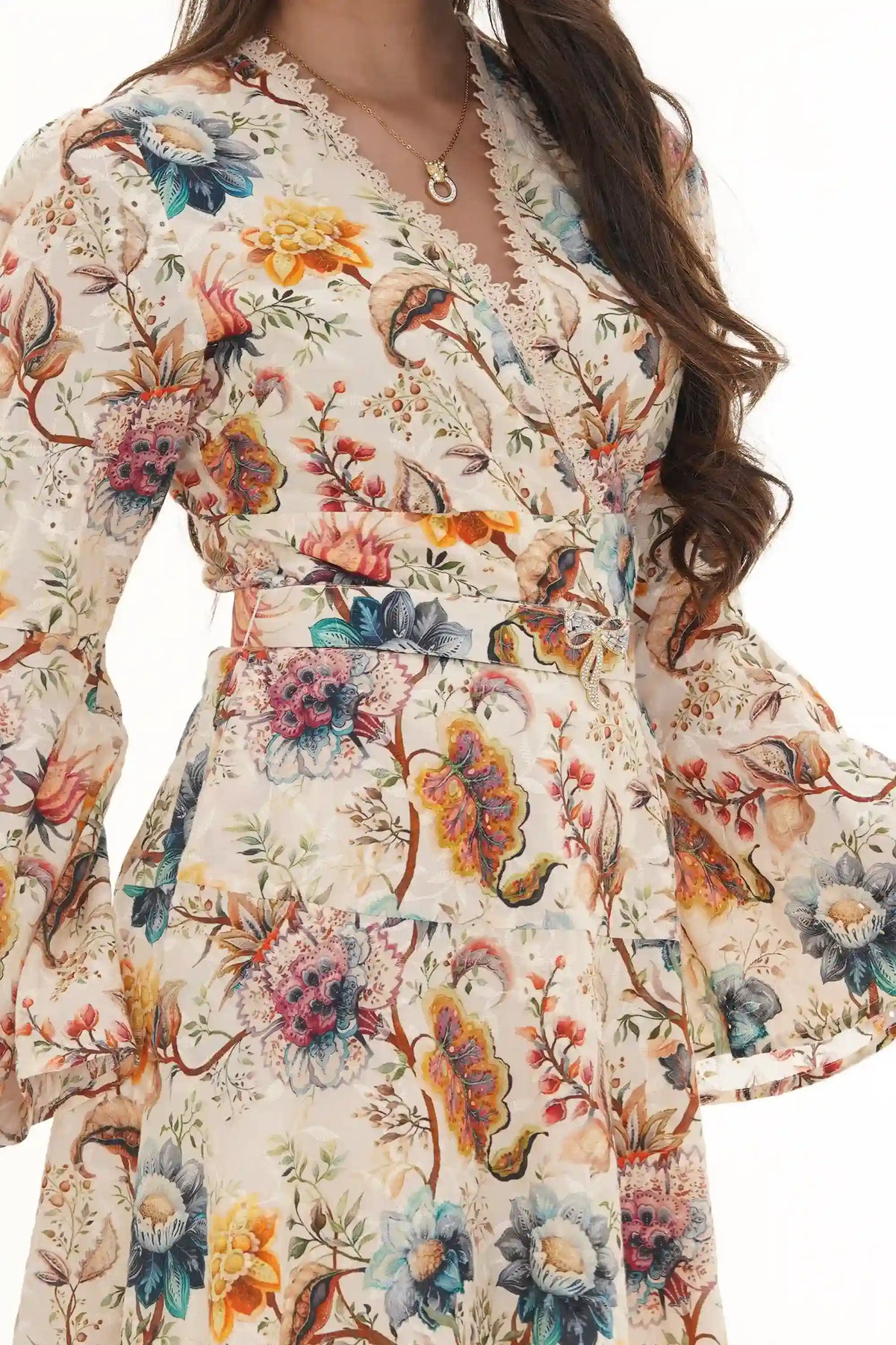 Close-up of Pretty Pixie ivory floral belted button-front mini dress