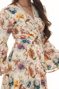 Close-up of Pretty Pixie ivory floral belted button-front mini dress
