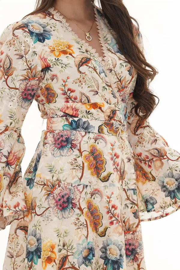 Close-up of Pretty Pixie ivory floral belted button-front mini dress