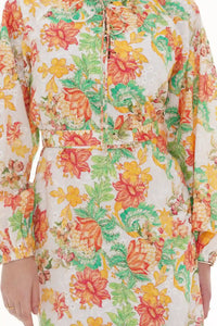 Close-up of Pretty Pixie ivory floral belted button-front mini dress, fabric detail