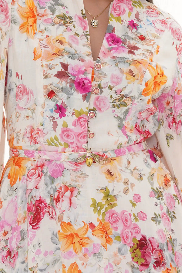 Close-up of Pretty Pixie ivory floral long-sleeve button mini dress
