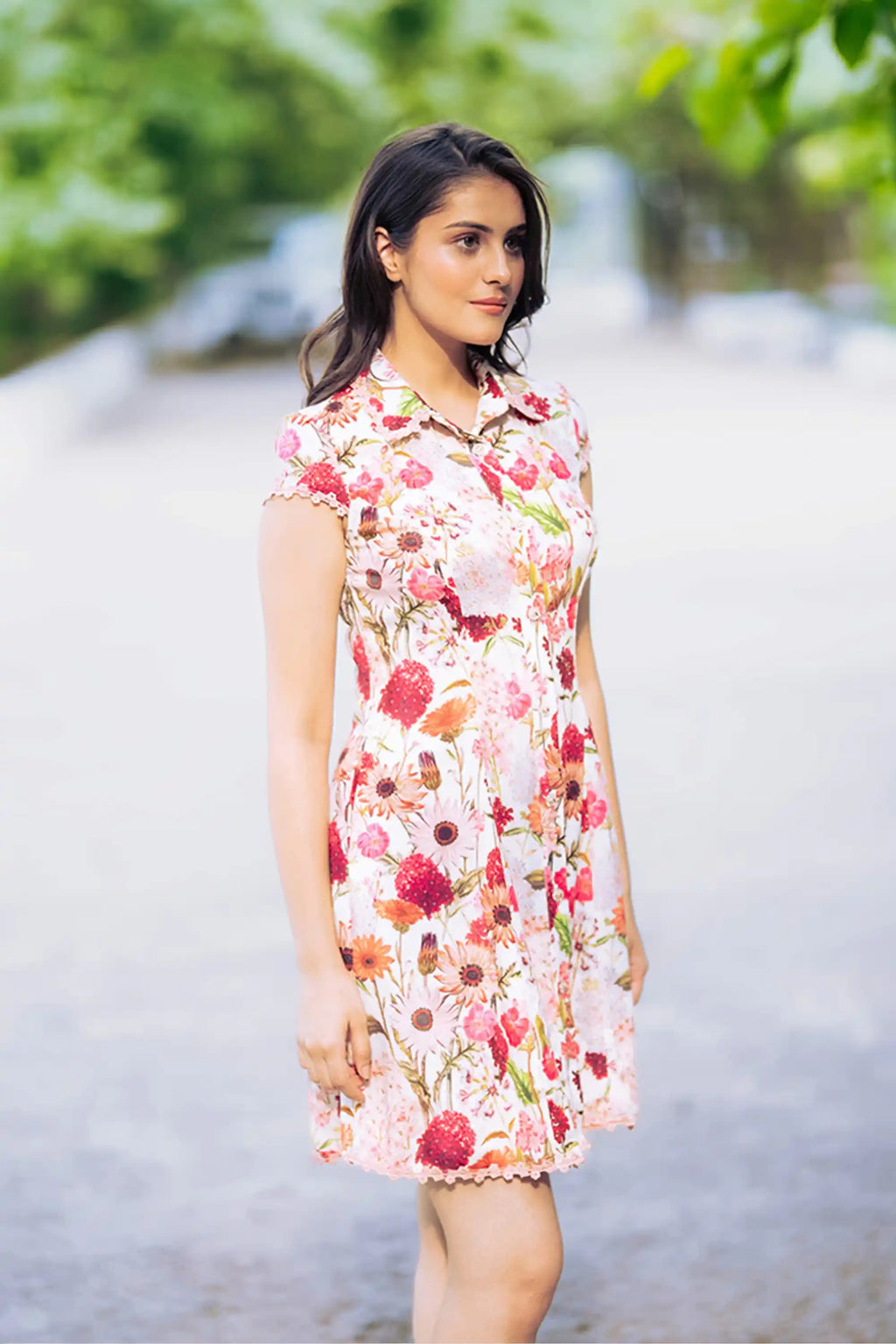 Side profile of ivory floral collared shirt dress with floral pattern