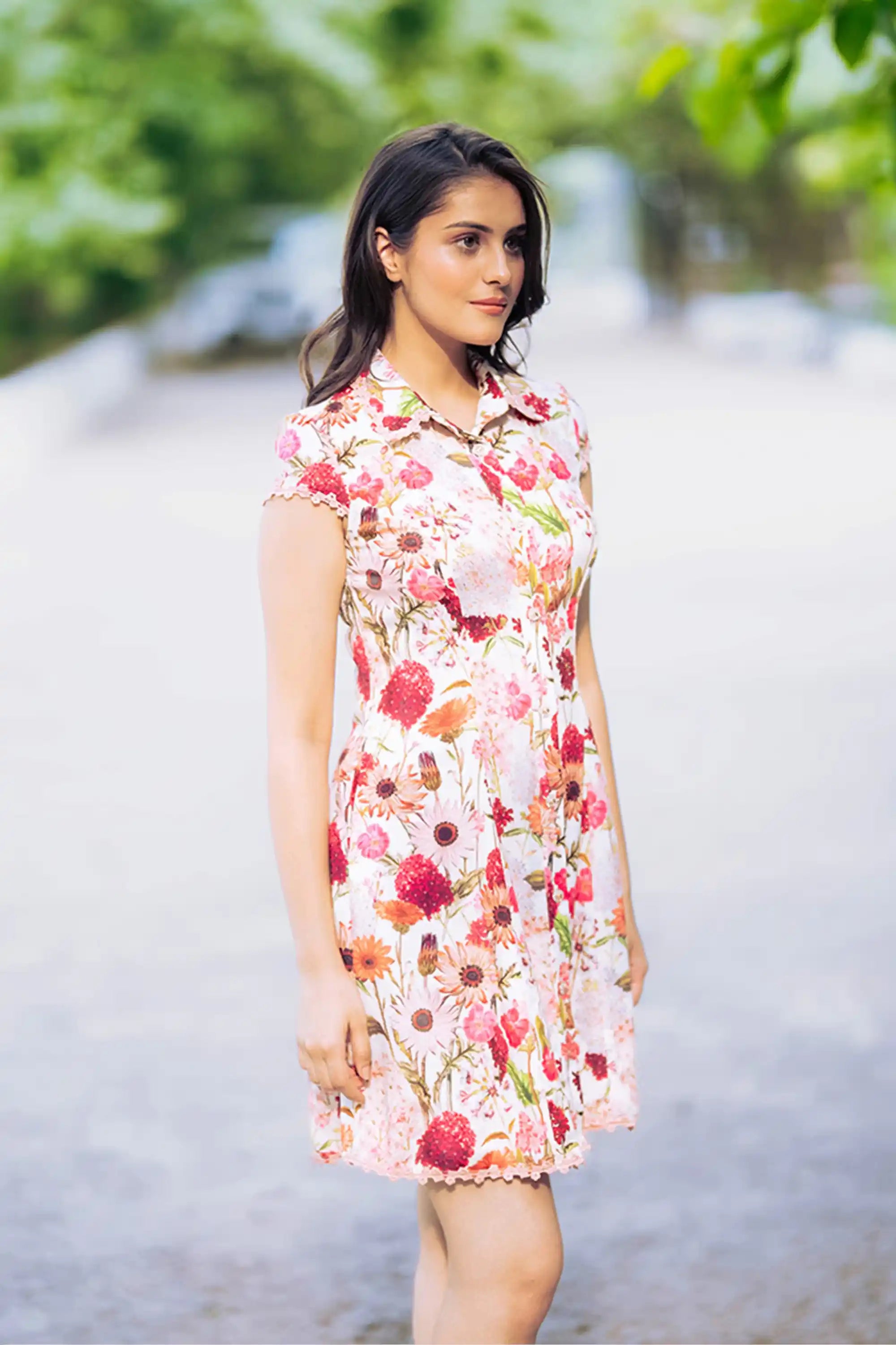 Side profile of ivory floral collared shirt dress with floral pattern