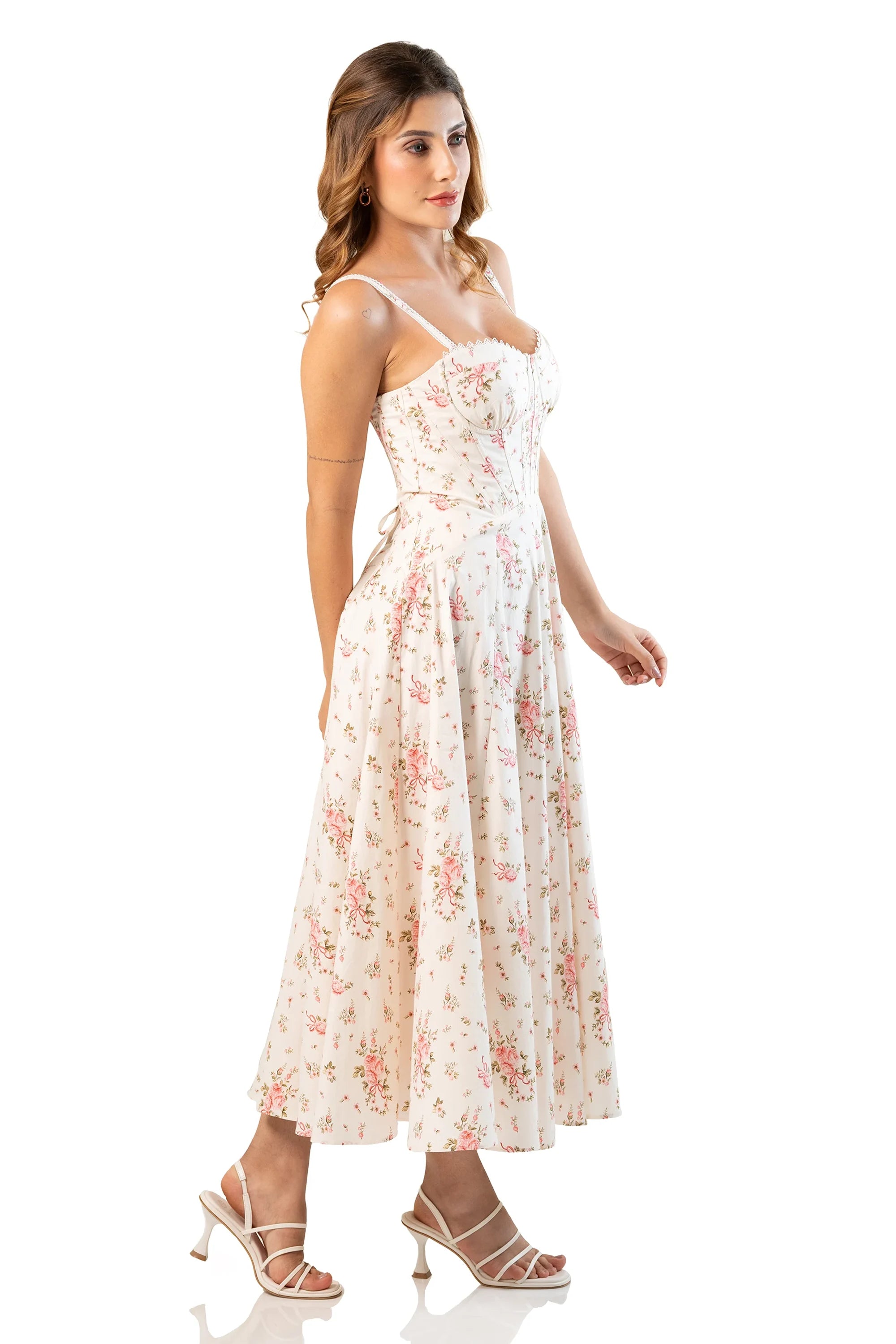 Side view of ivory floral cotton corset midi dress on model