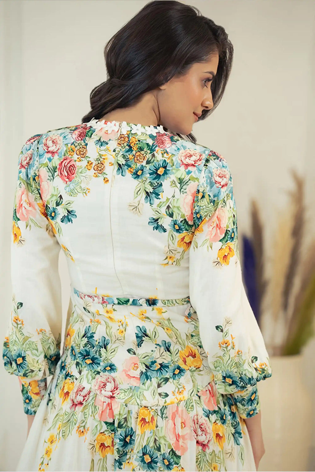 Back closeup of ivory floral mini dress showing floral print details