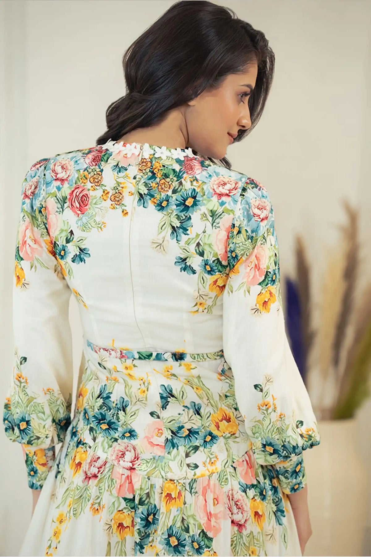 Back closeup of ivory floral mini dress showing floral print details