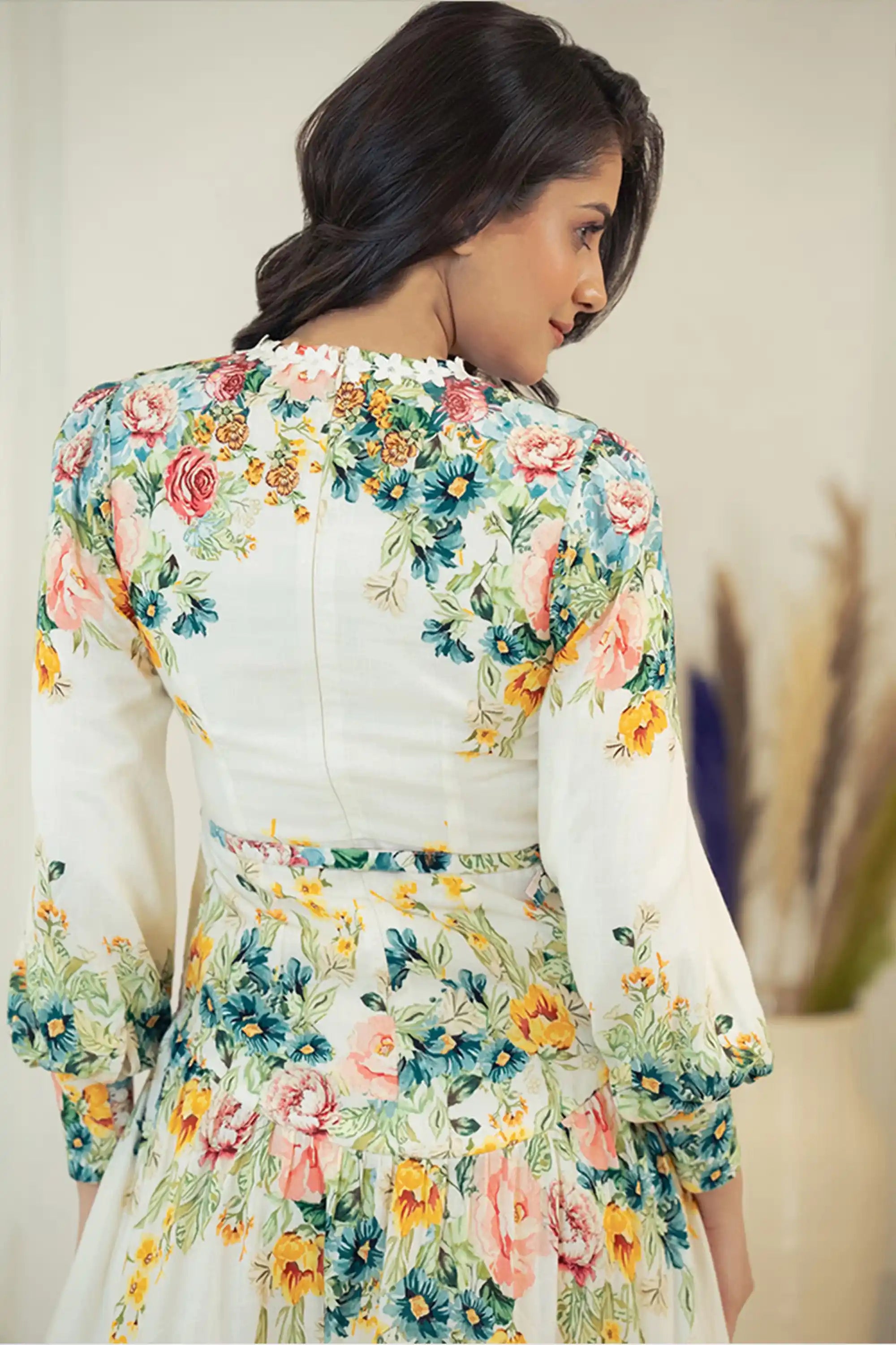 Back closeup of ivory floral mini dress showing floral print details