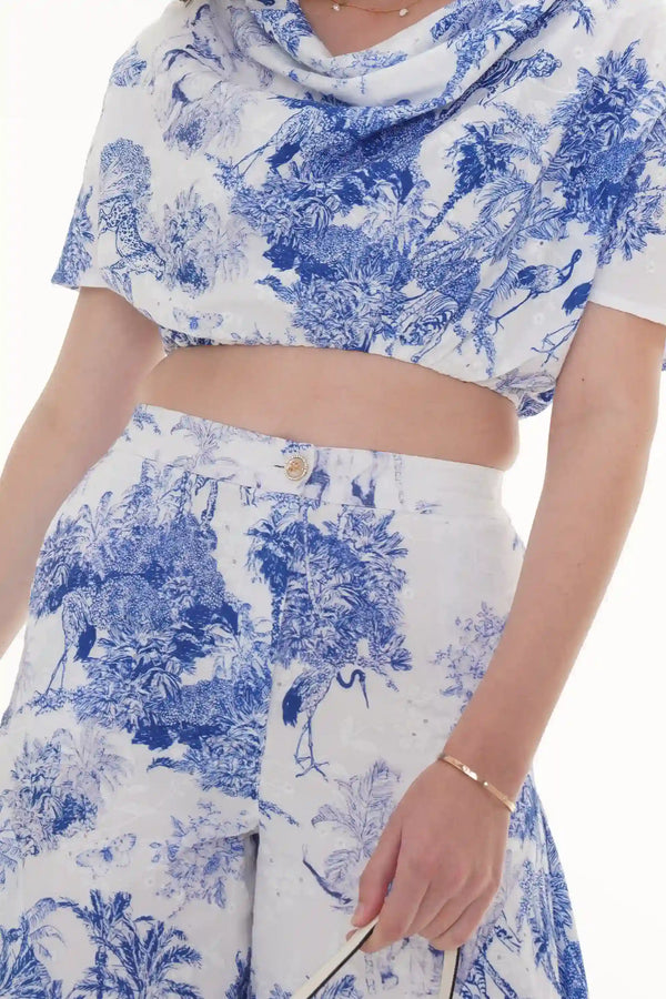 Close-up of Pretty Pixie ivory floral puff-sleeve belted mini dress