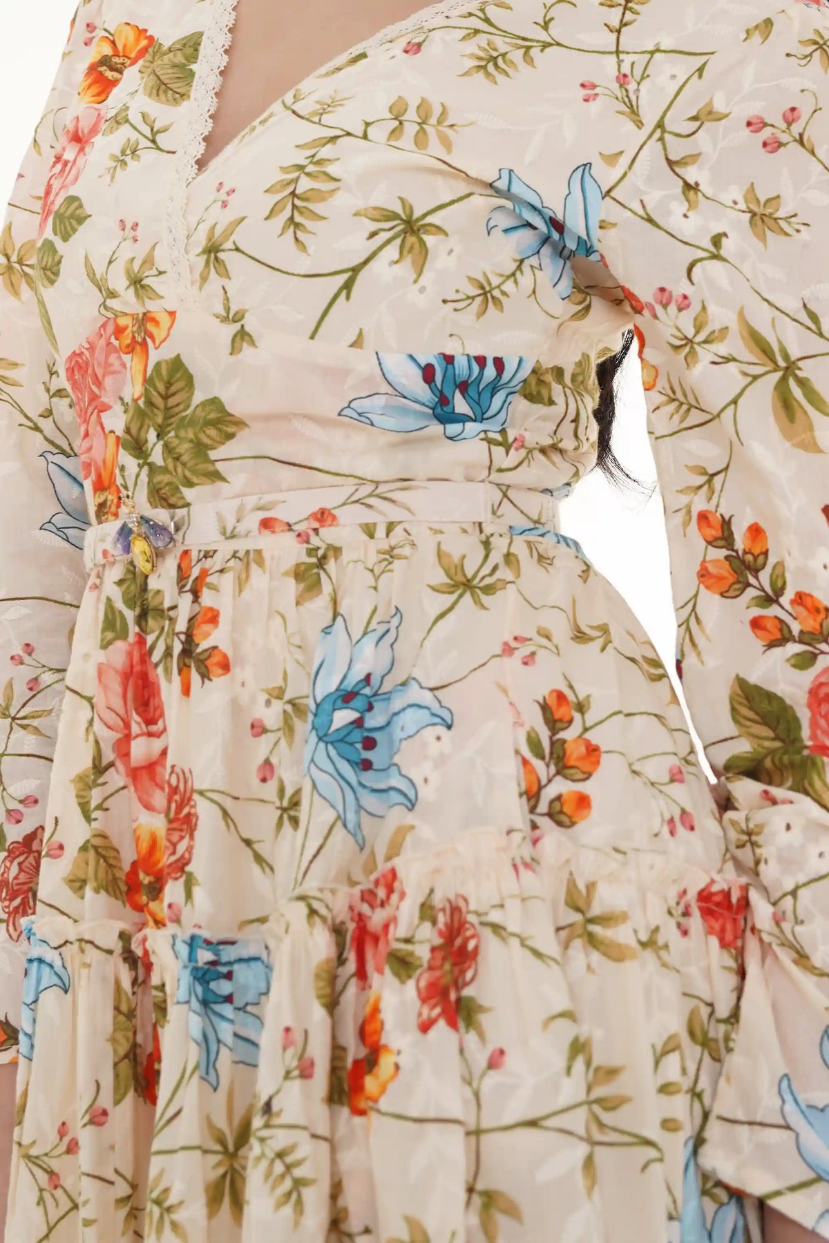 Close-up of Pretty Pixie ivory floral puff-sleeve belted mini dress, sleeve detail