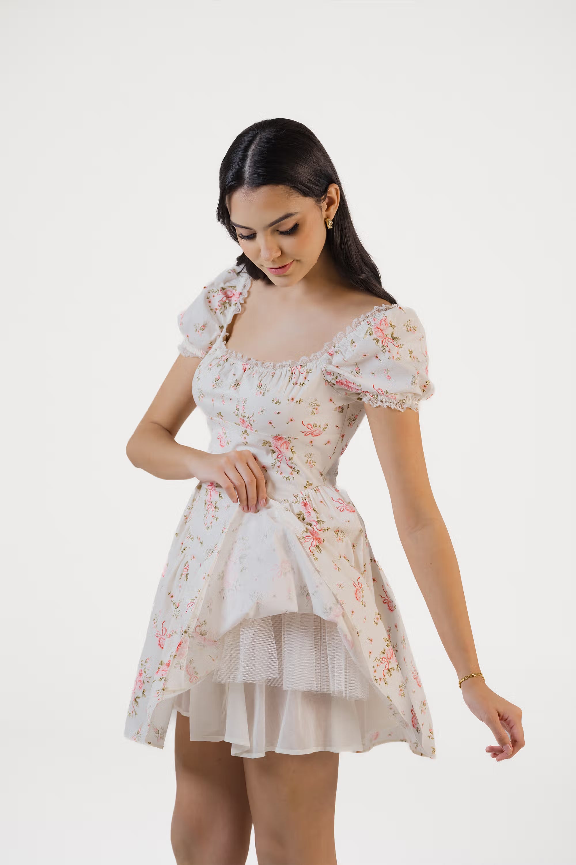 Ivory floral puff sleeve dress showing layered underskirt and tulle detail