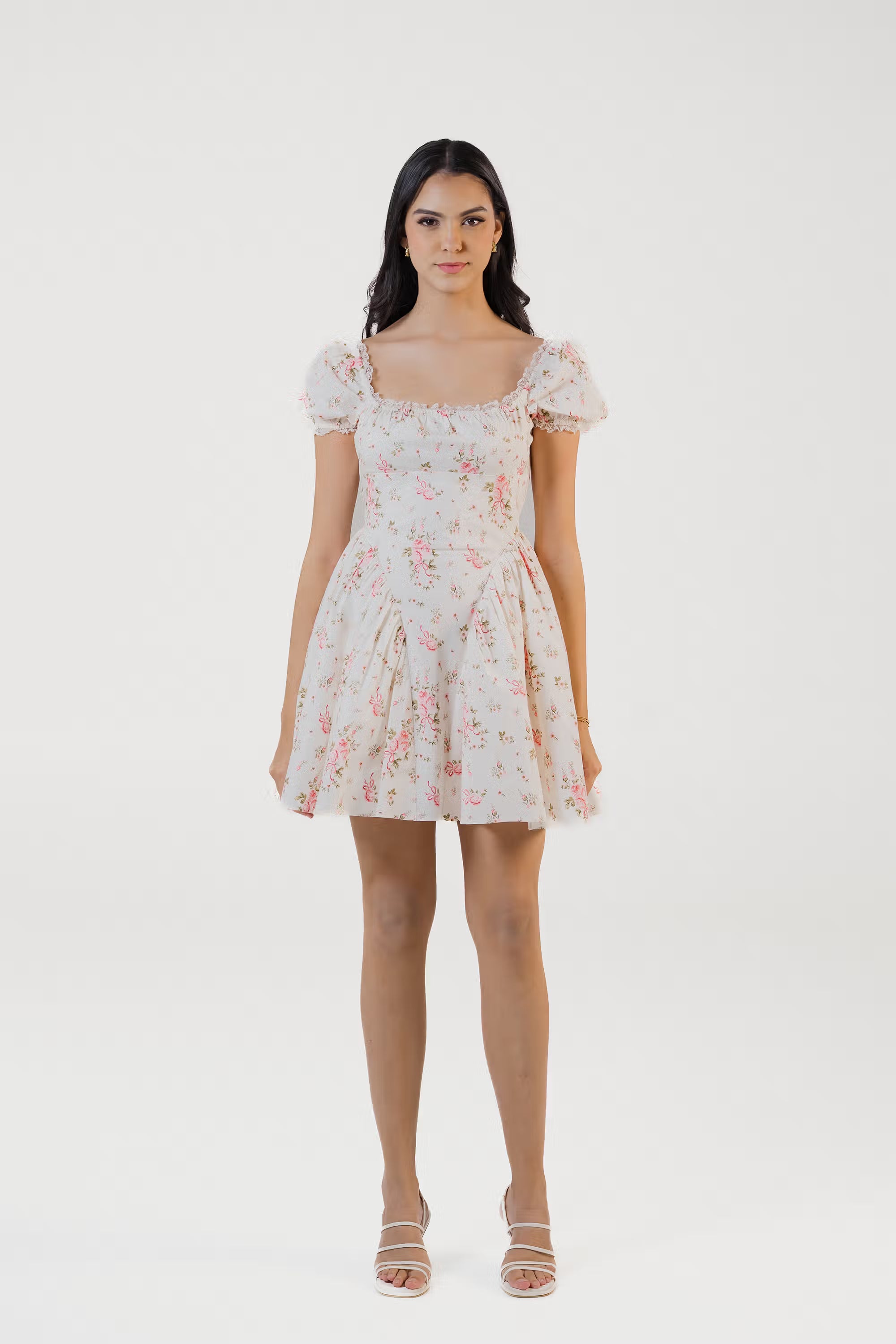 Front view of ivory floral puff sleeve mini dress with pink roses and square neckline