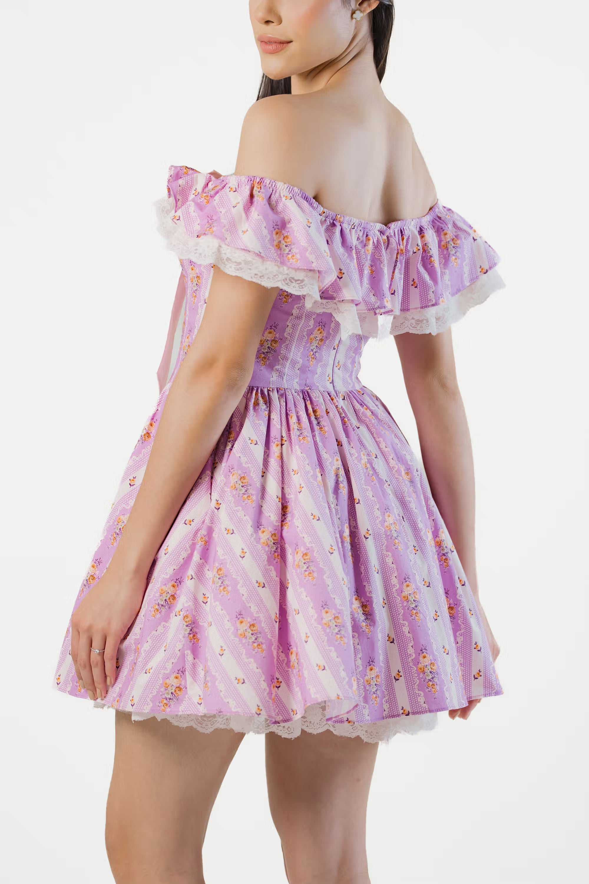 Back view of lavender floral off-shoulder mini dress with bow