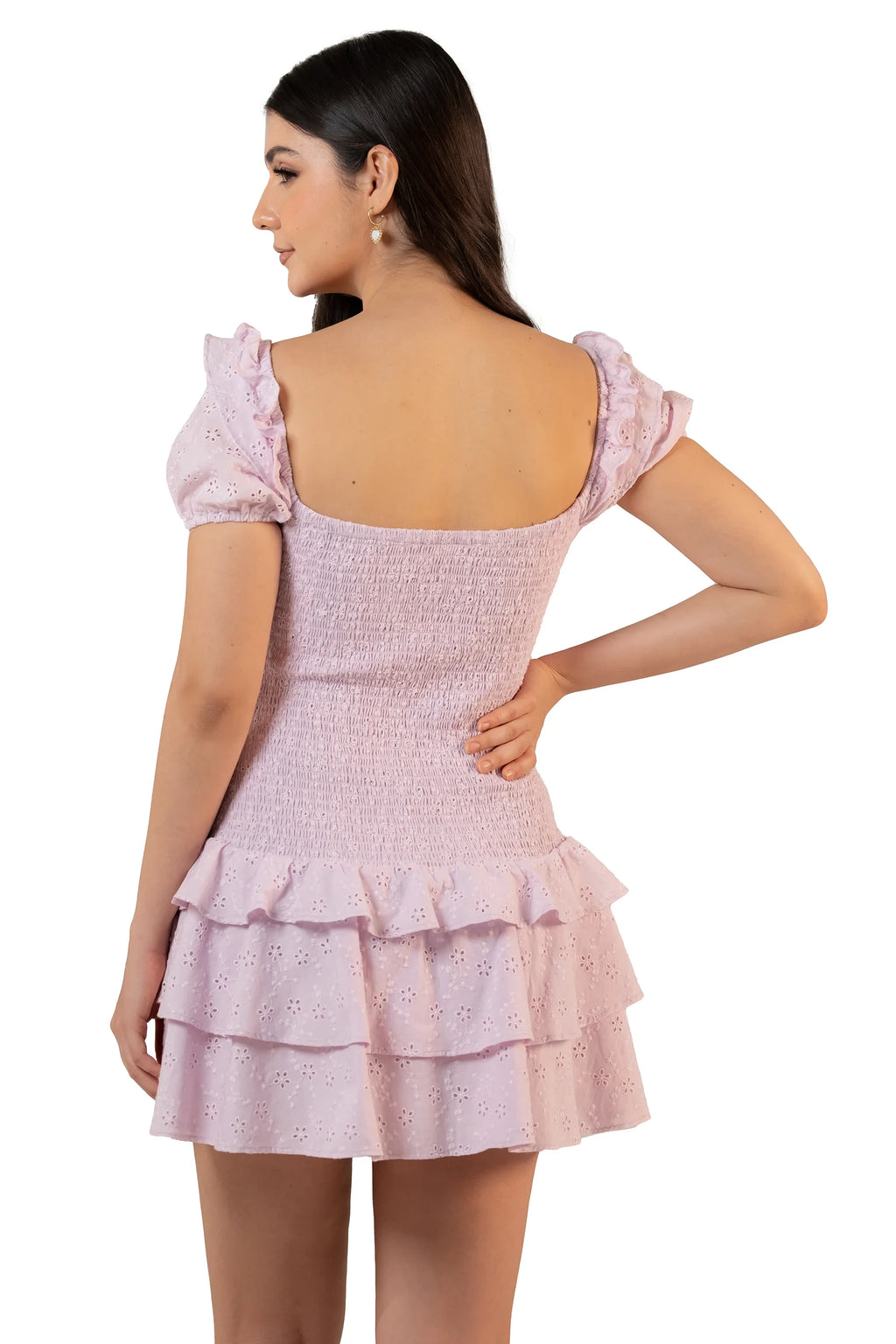 Back view of lavender eyelet mini dress with low square back, full smocking, and double tiered ruffle hem.