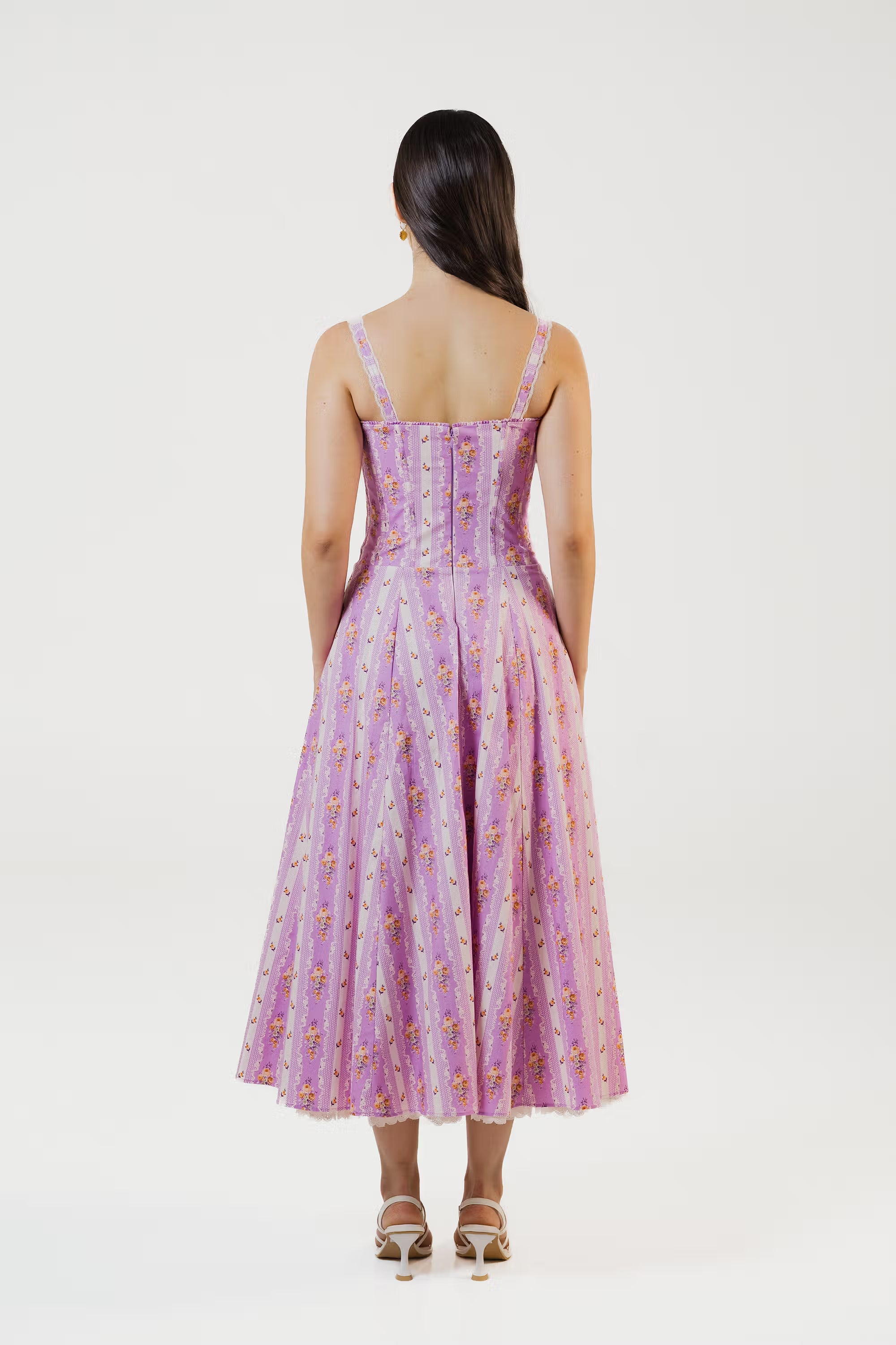 Closeup of corset bodice with delicate floral print on lavender midi dress