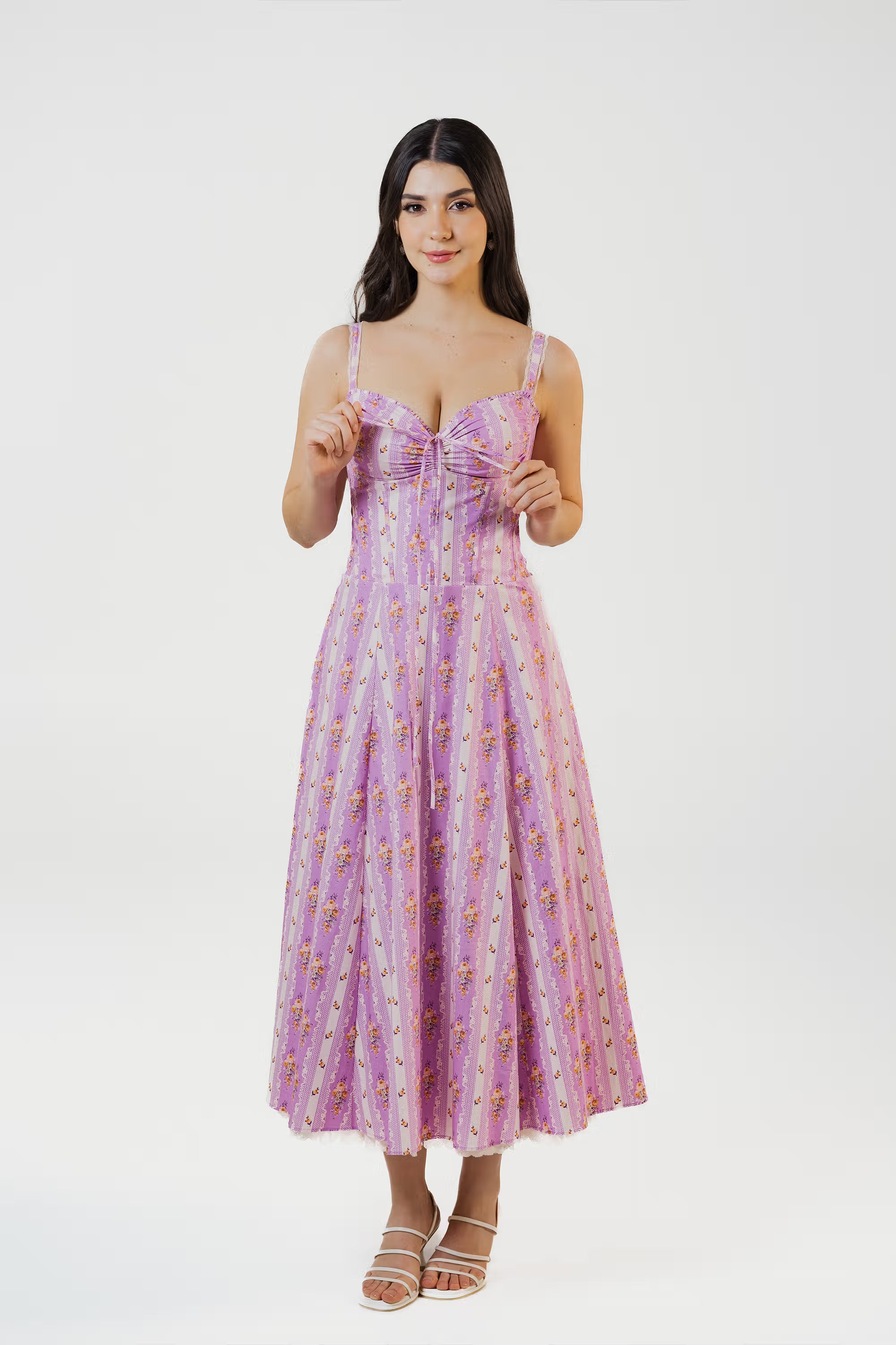 Closeup of corset bodice with delicate floral print on lavender midi dress