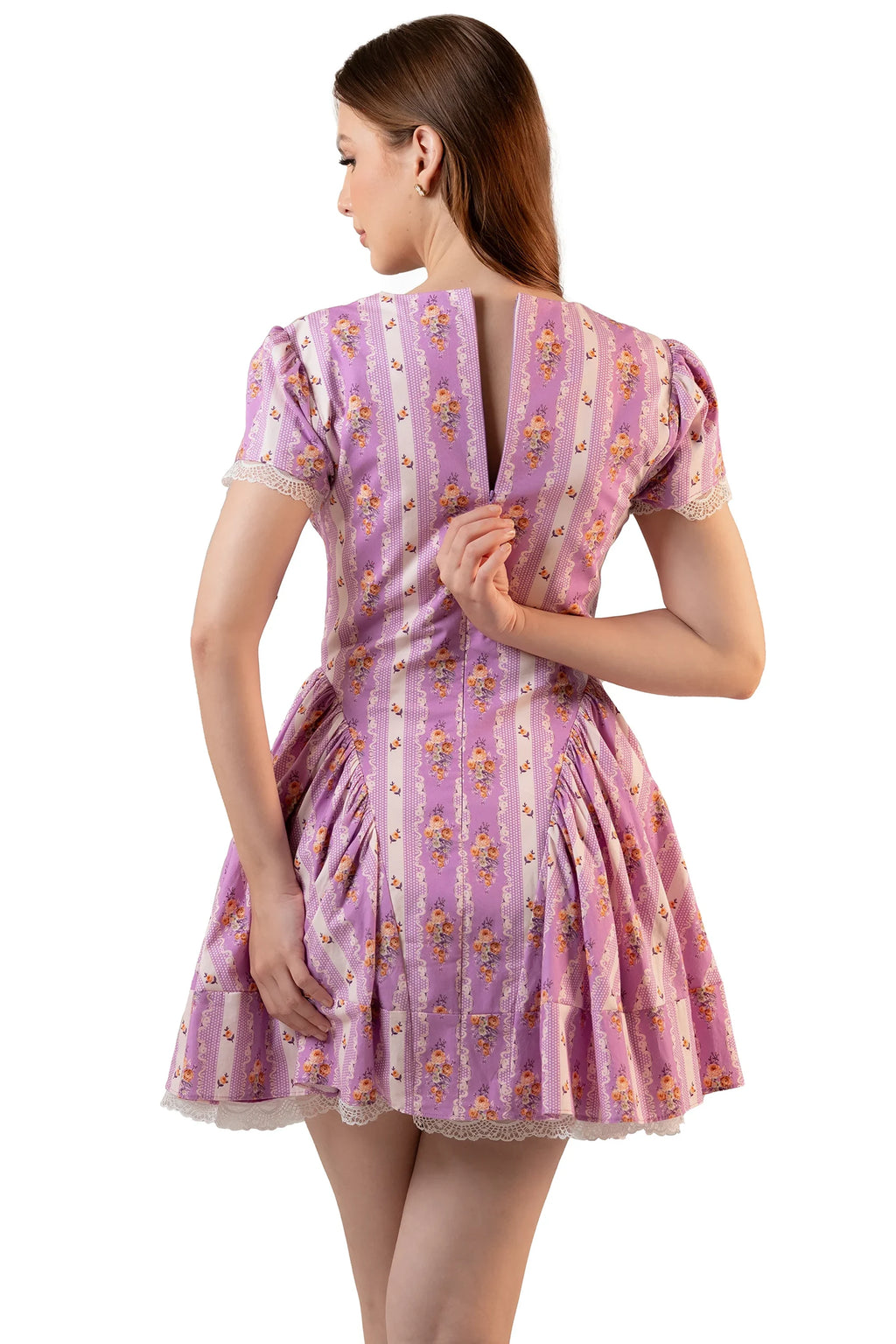 Back view of lavender floral mini dress with center-back zipper opening, puff sleeves and scalloped lace hem