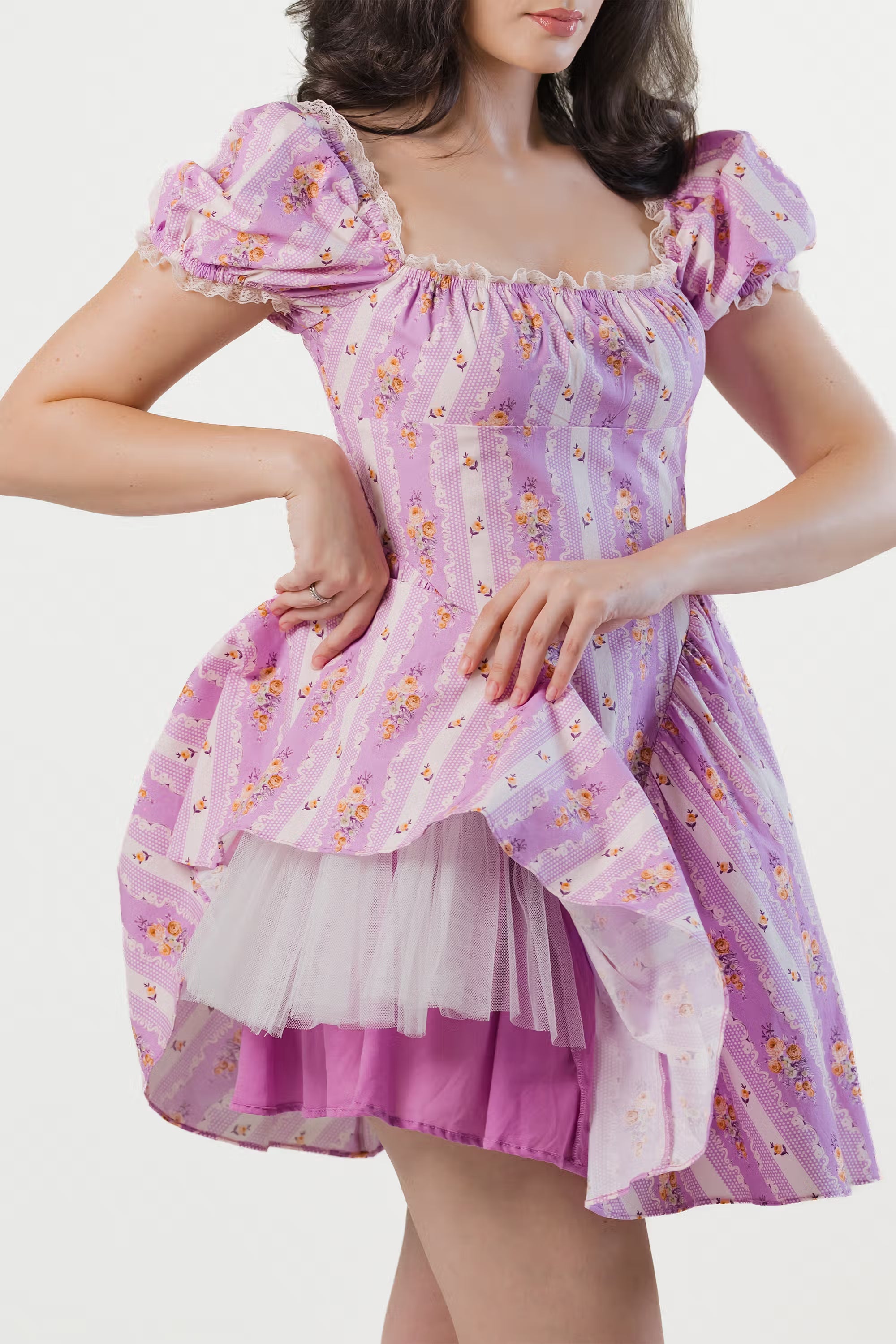 Romantic floral lavender dress showing layered tulle petticoat for extra volume.