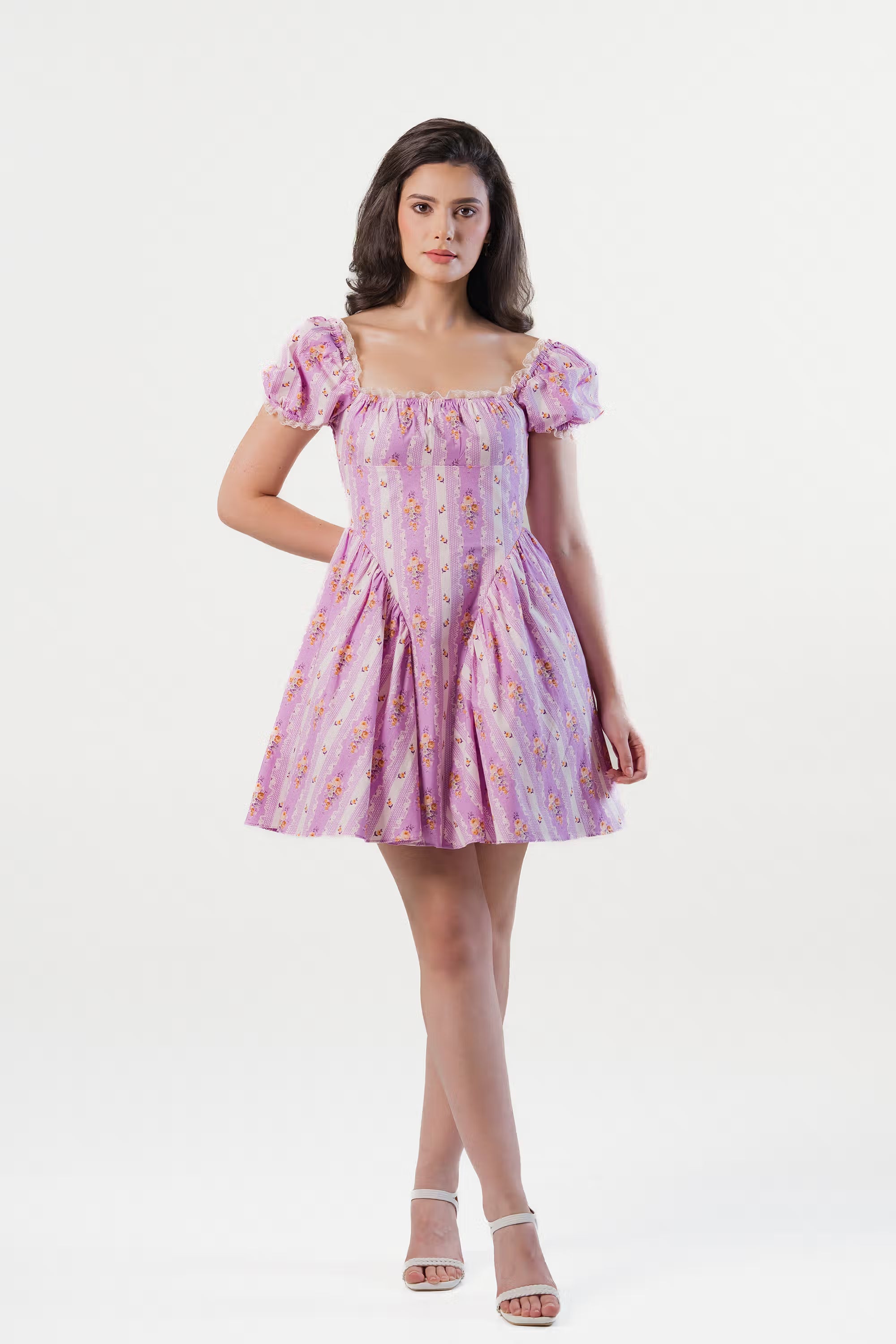 Elegant lavender mini dress with puff sleeves, floral print, and square neckline.