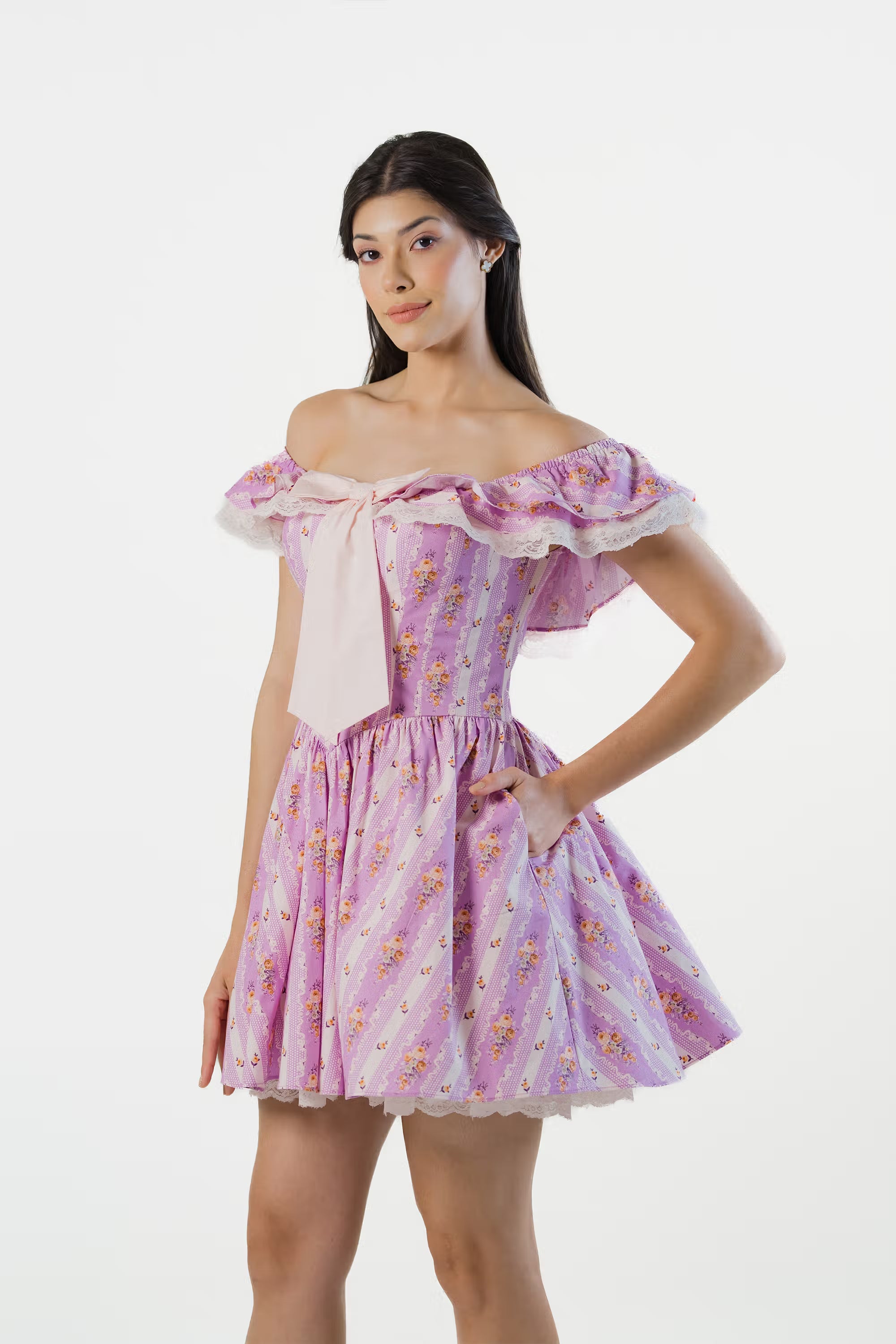 Side angle of lavender off-shoulder floral mini dress with flared skirt and lace trim.