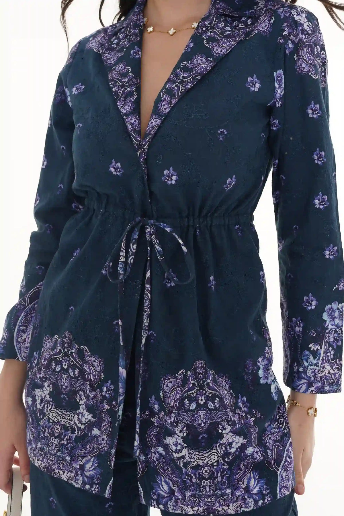 Close-up of Pretty Pixie light blue toile floral V-neck ruffle midi dress