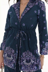 Close-up of Pretty Pixie light blue toile floral V-neck ruffle midi dress
