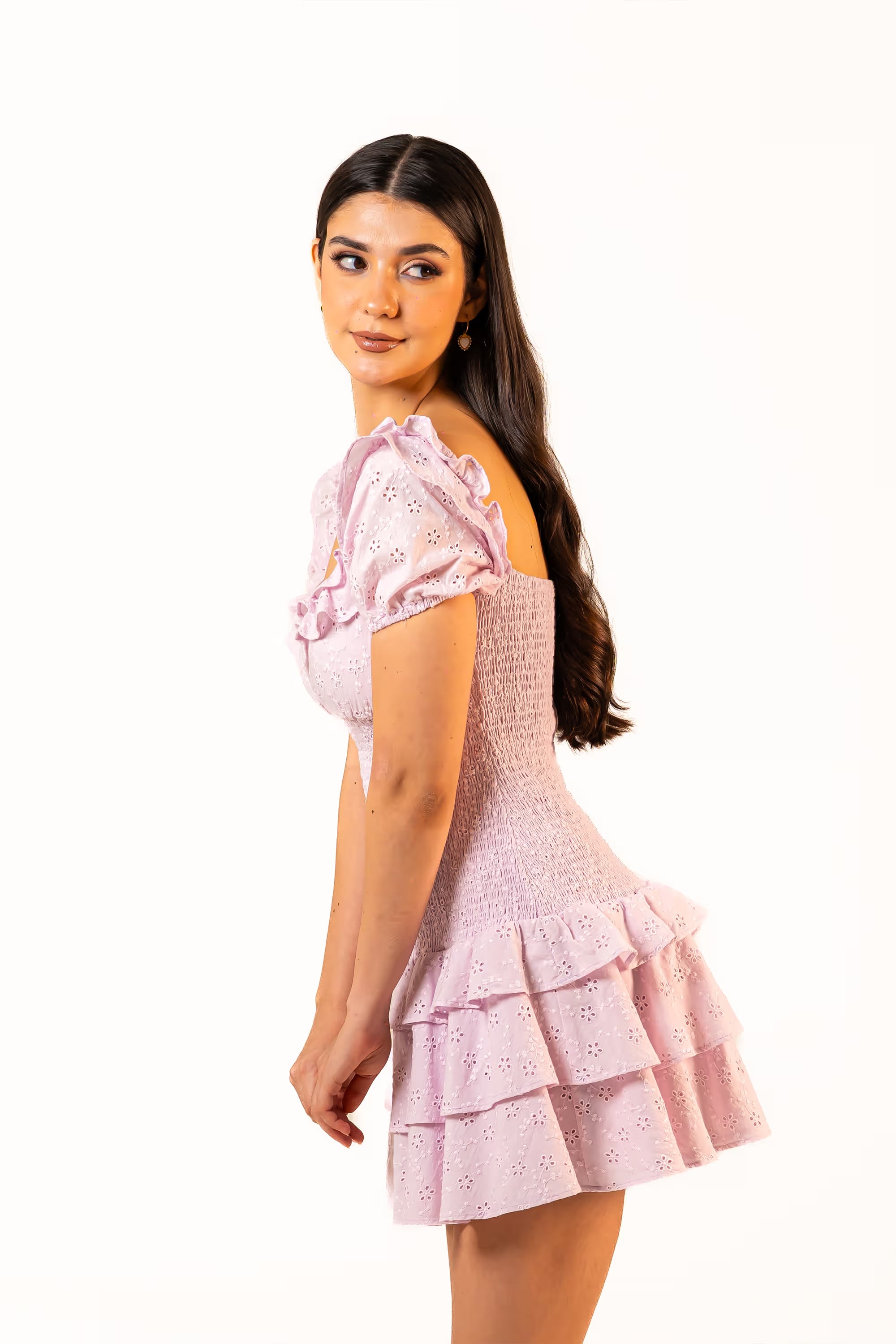 Side view of lilac puff sleeve eyelet mini dress with ruffle details and tiered hem, chic floral fashion