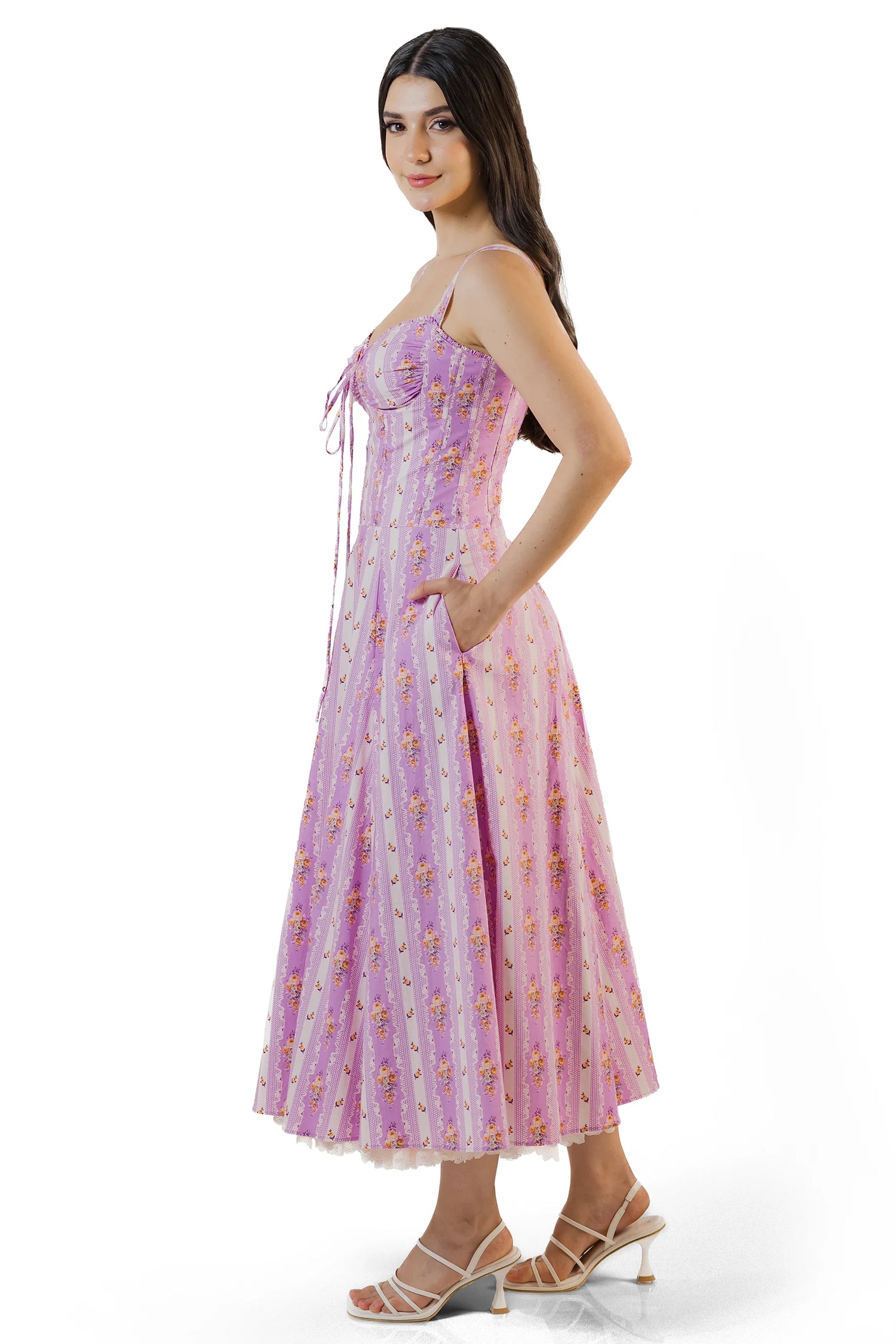 Side view showing pockets on lilac floral corset midi dress