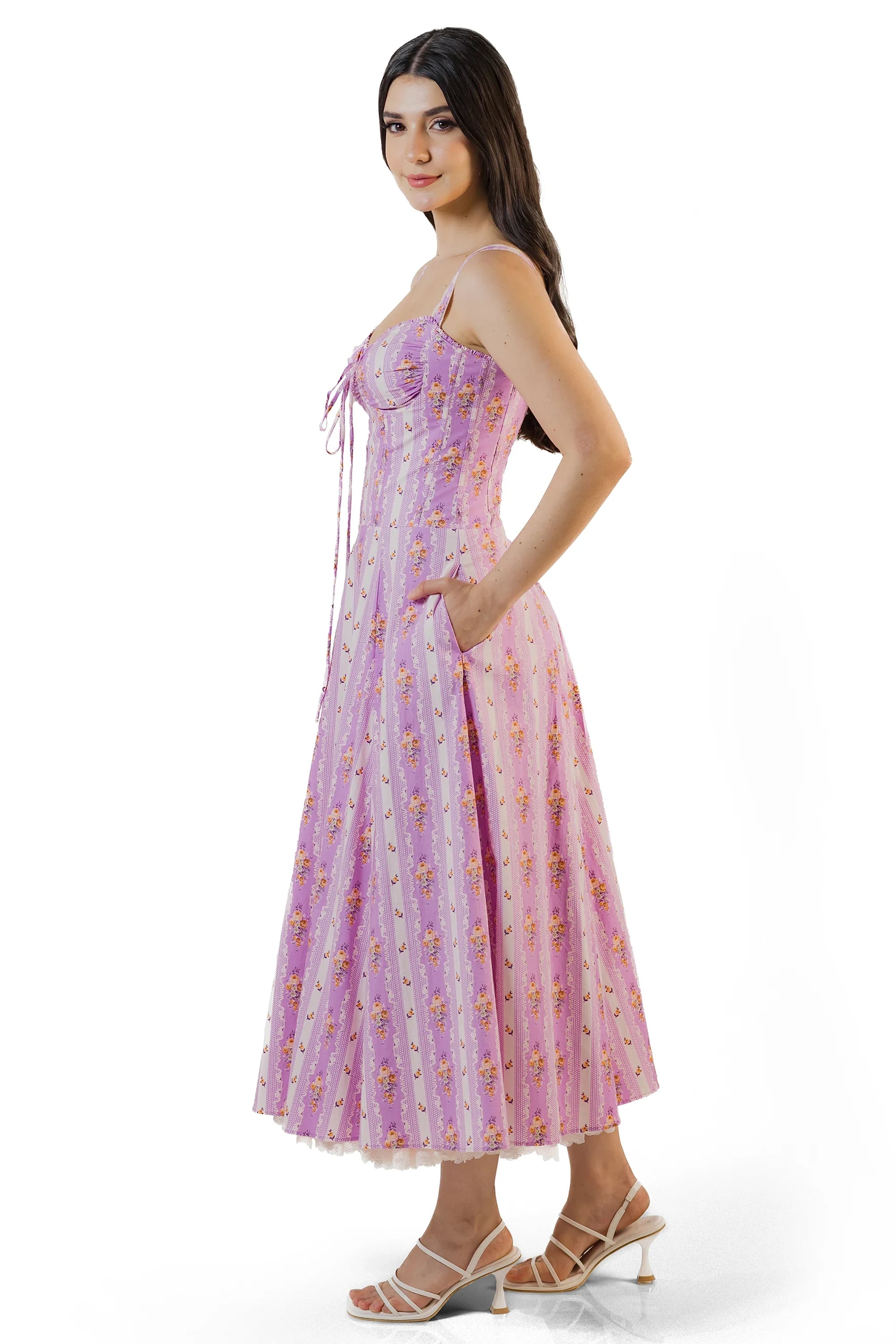 Side view showing pockets on lilac floral corset midi dress