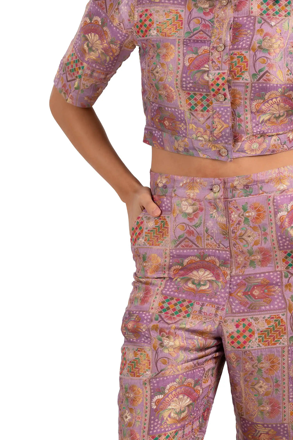 Close-up of high-waist pants pocket and button on lilac jacquard co-ord set