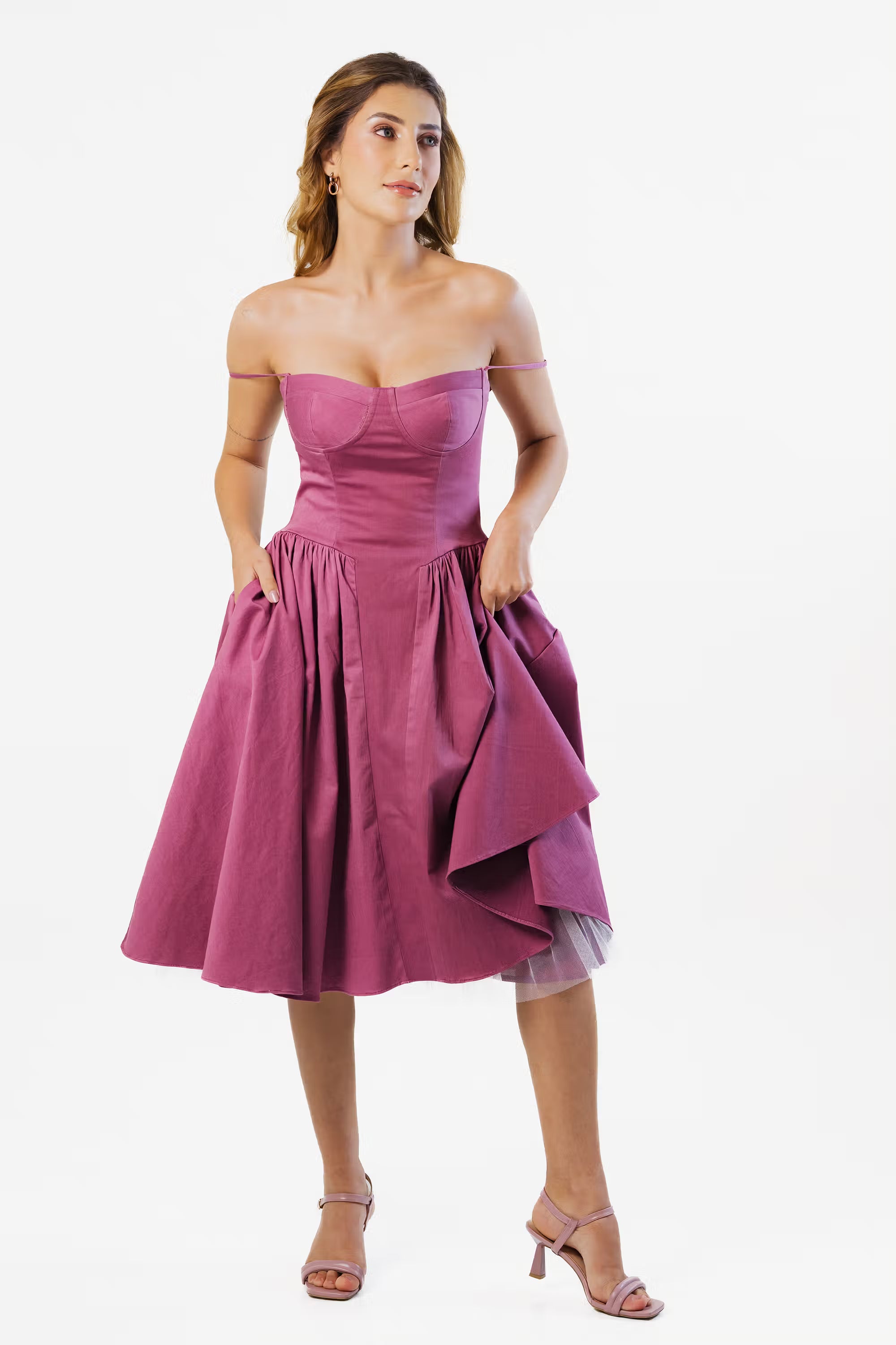 Off-shoulder plum midi dress with feminine neckline, elegant partywear choice for evening gatherings.