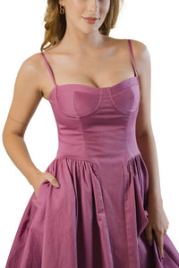 Front close-up of mauve cotton midi dress with bustier bodice and side pockets, gathered A-line skirt