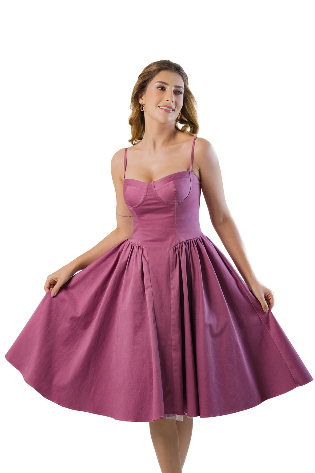 Mauve cotton midi dress showing flared skirt movement with tulle underskirt, bustier top and straps