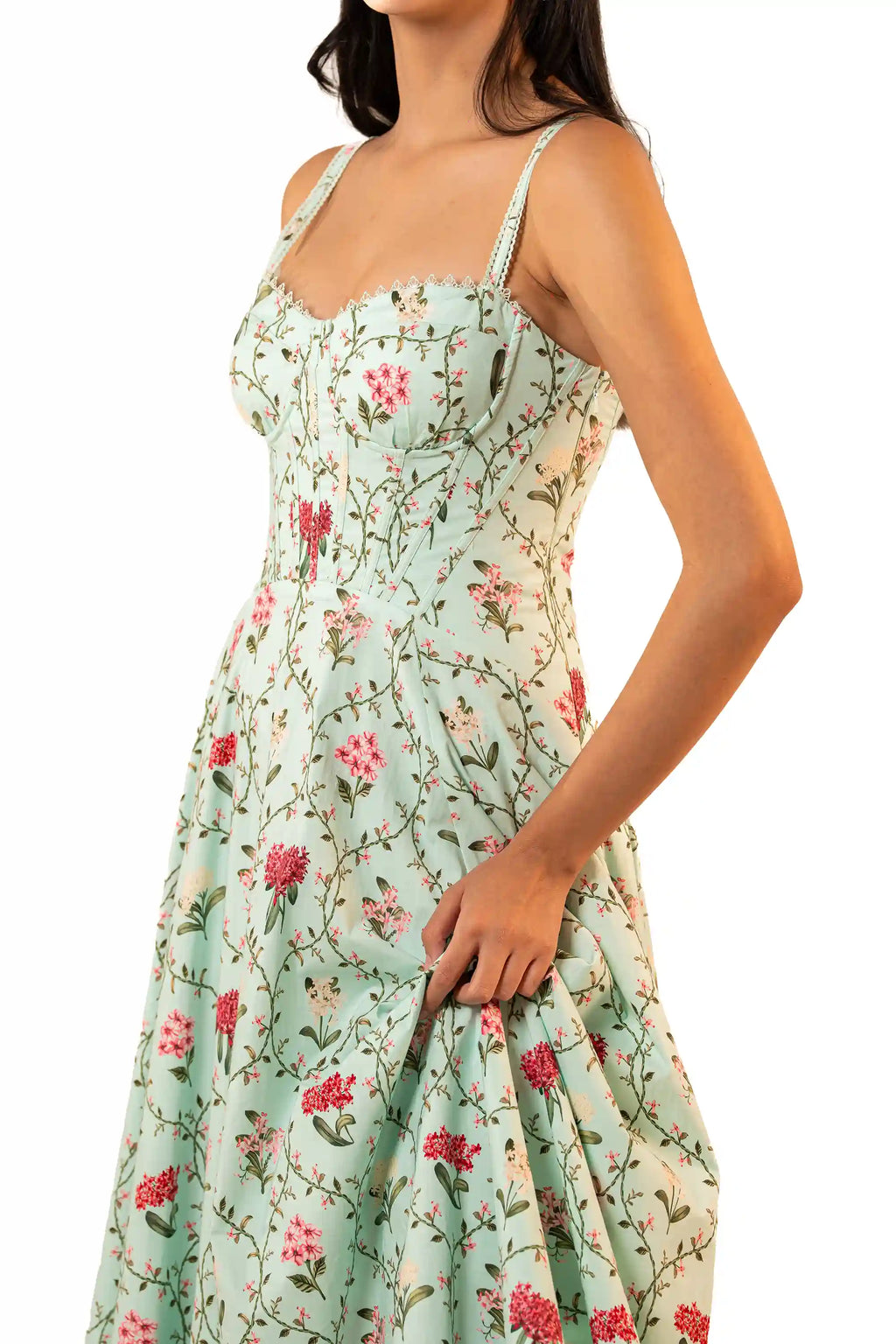 Side close-up of sweetheart bustier bodice on mint green floral midi dress