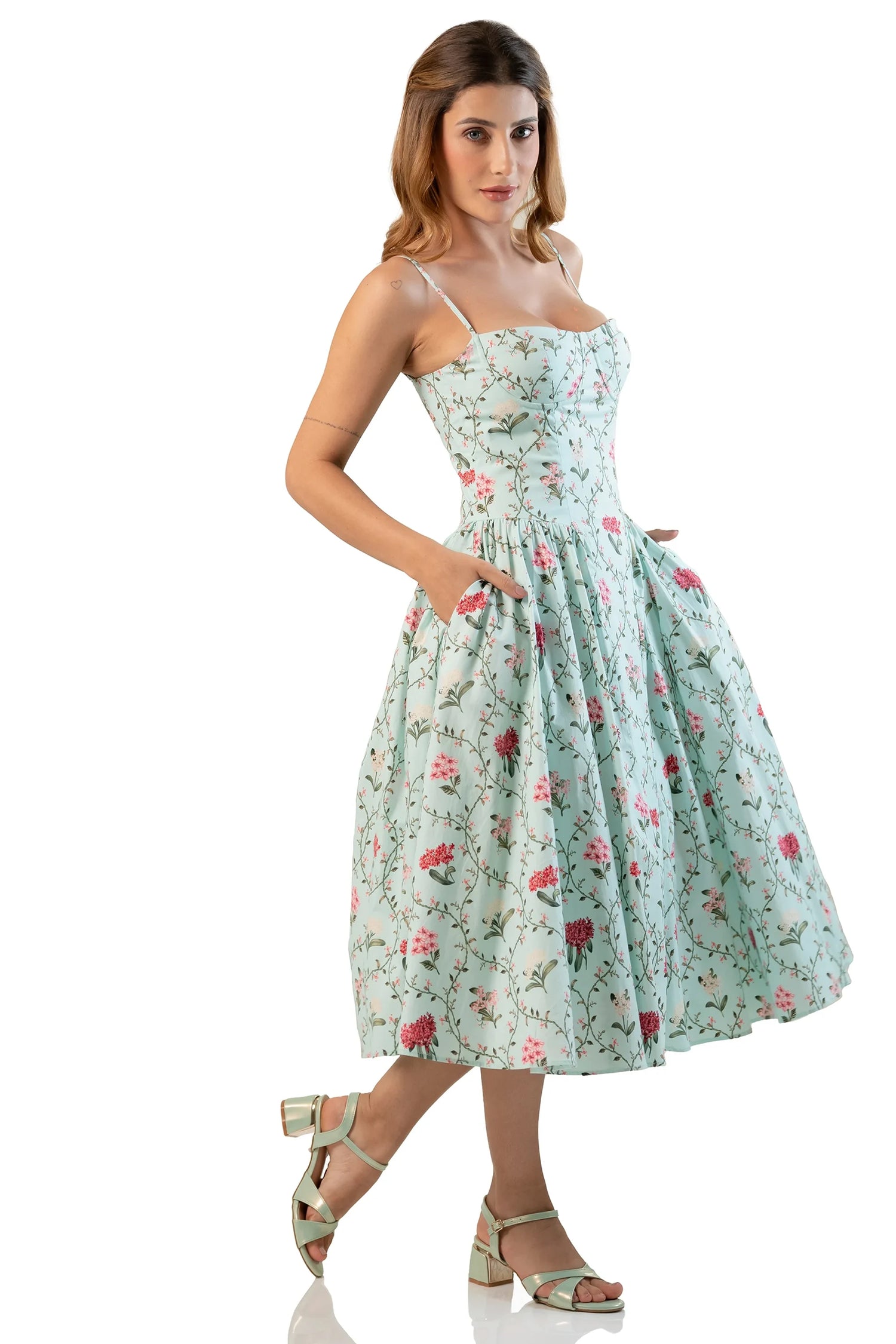Side view showing pockets on mint floral midi dress