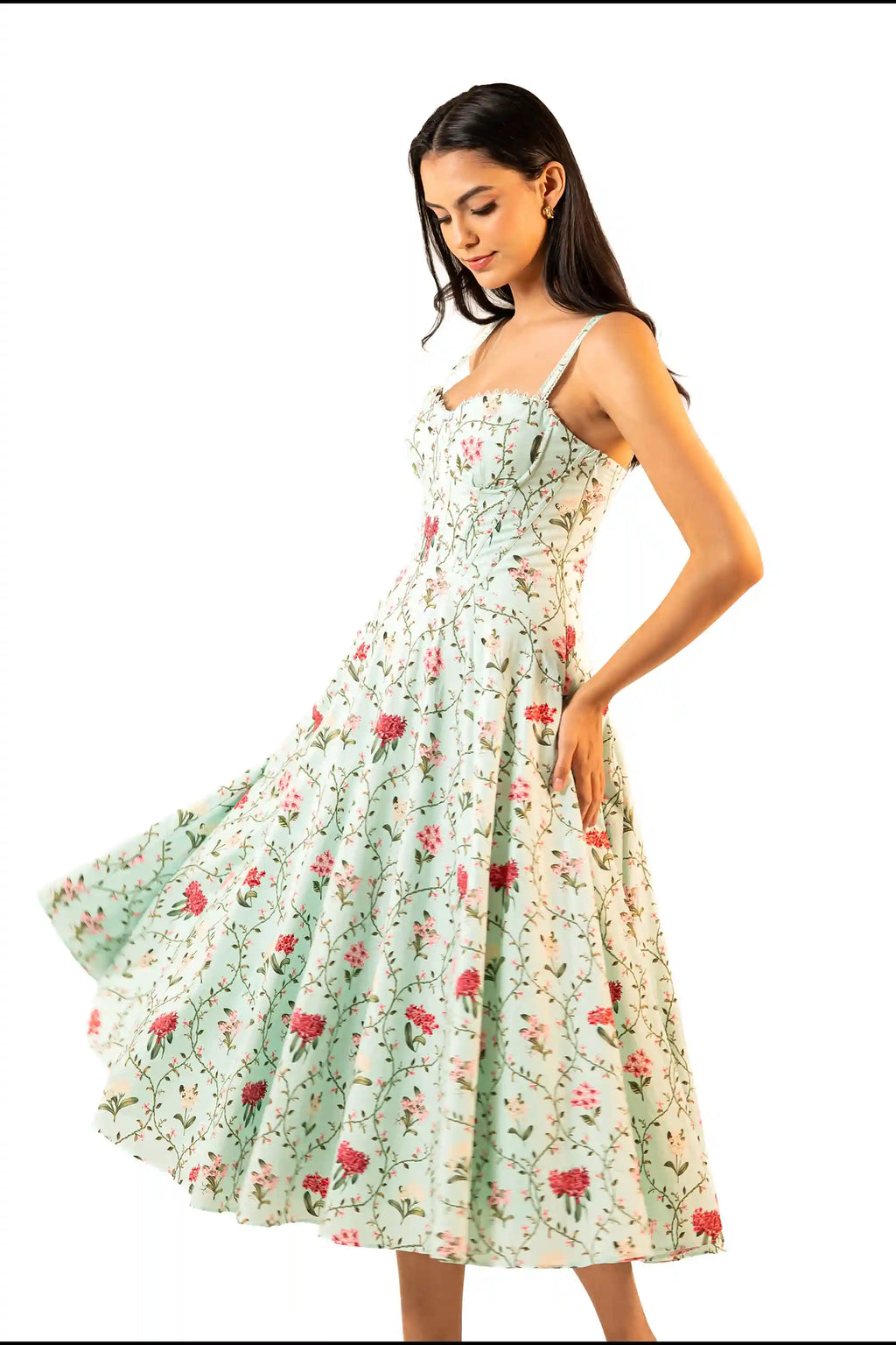 Side angle showing twirl movement of mint floral midi dress with structured bodice and flowing skirt