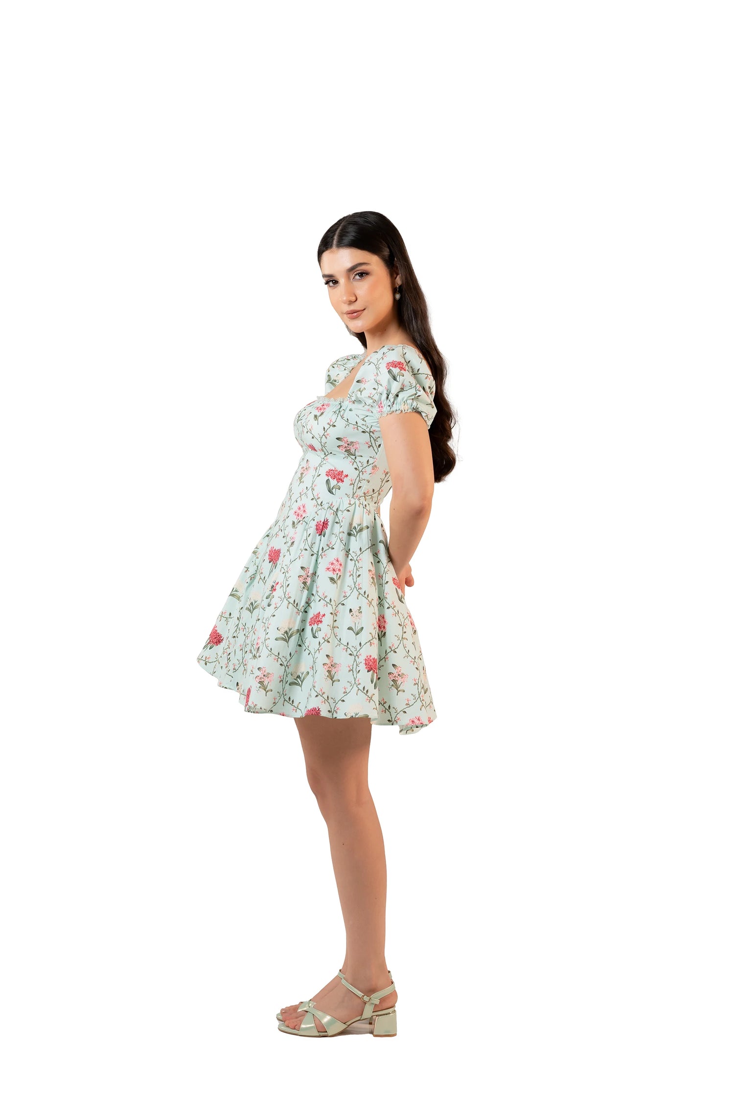 Side view of mint floral mini dress with puff sleeves