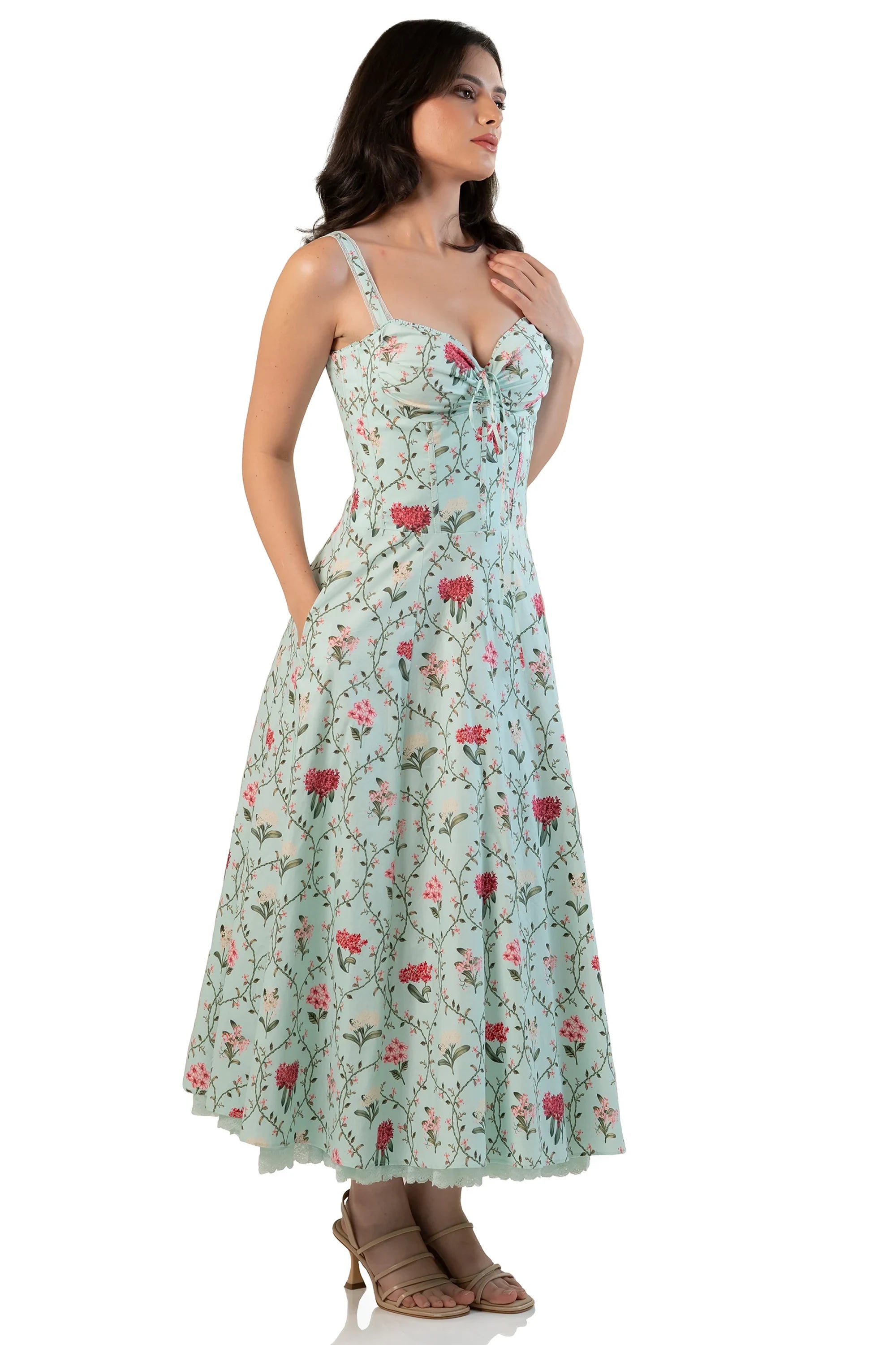 Side view of mint floral ruched-bust midi dress on model