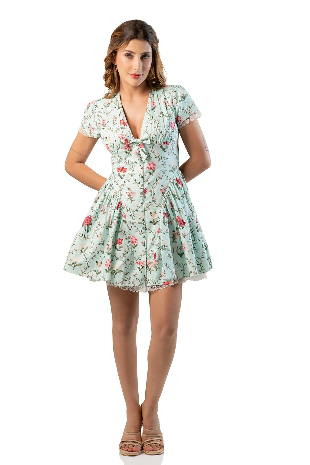 Front view, hands on waist: mint floral short-sleeve V-neck mini, flared skirt
