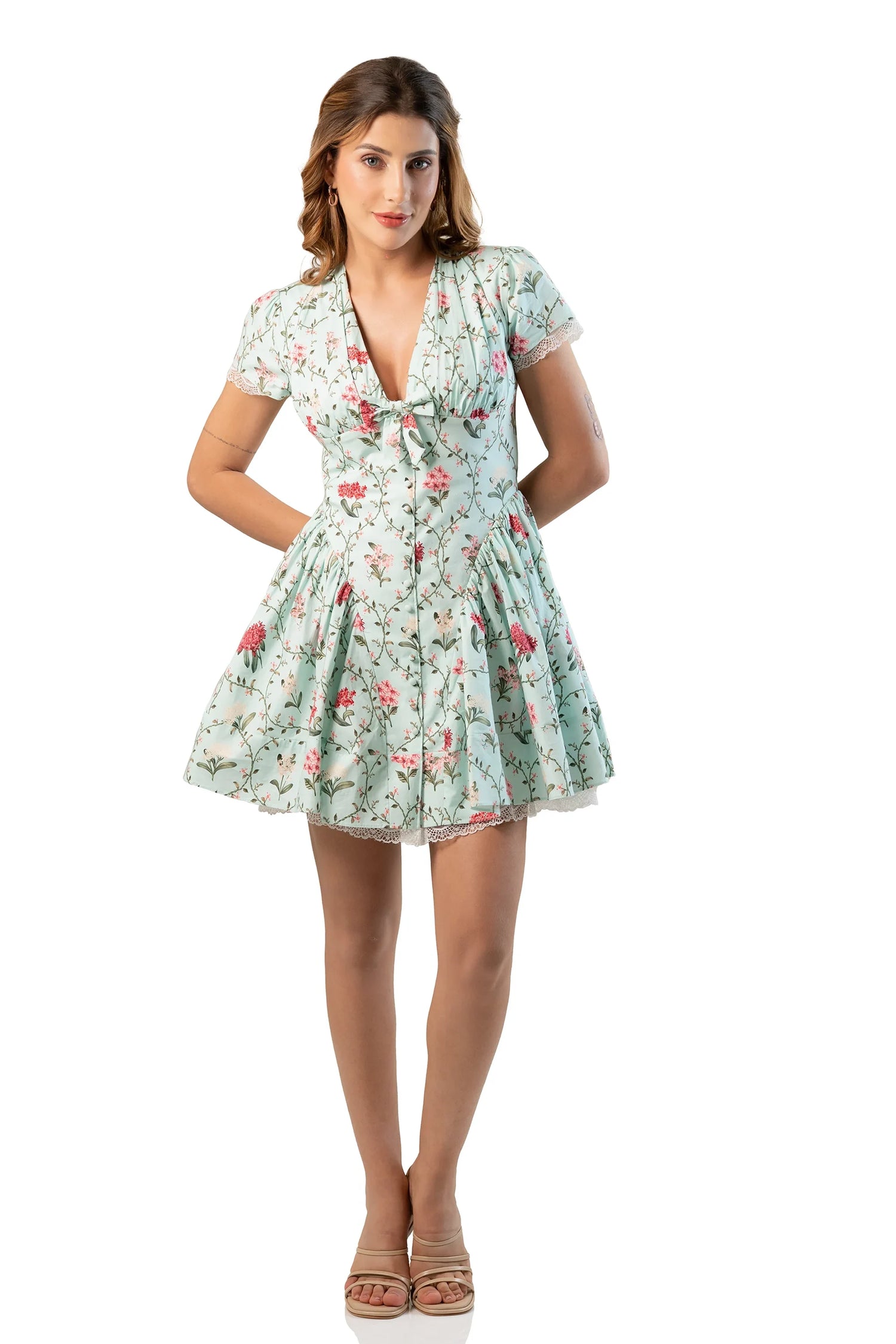 Front view, hands on waist: mint floral short-sleeve V-neck mini, flared skirt
