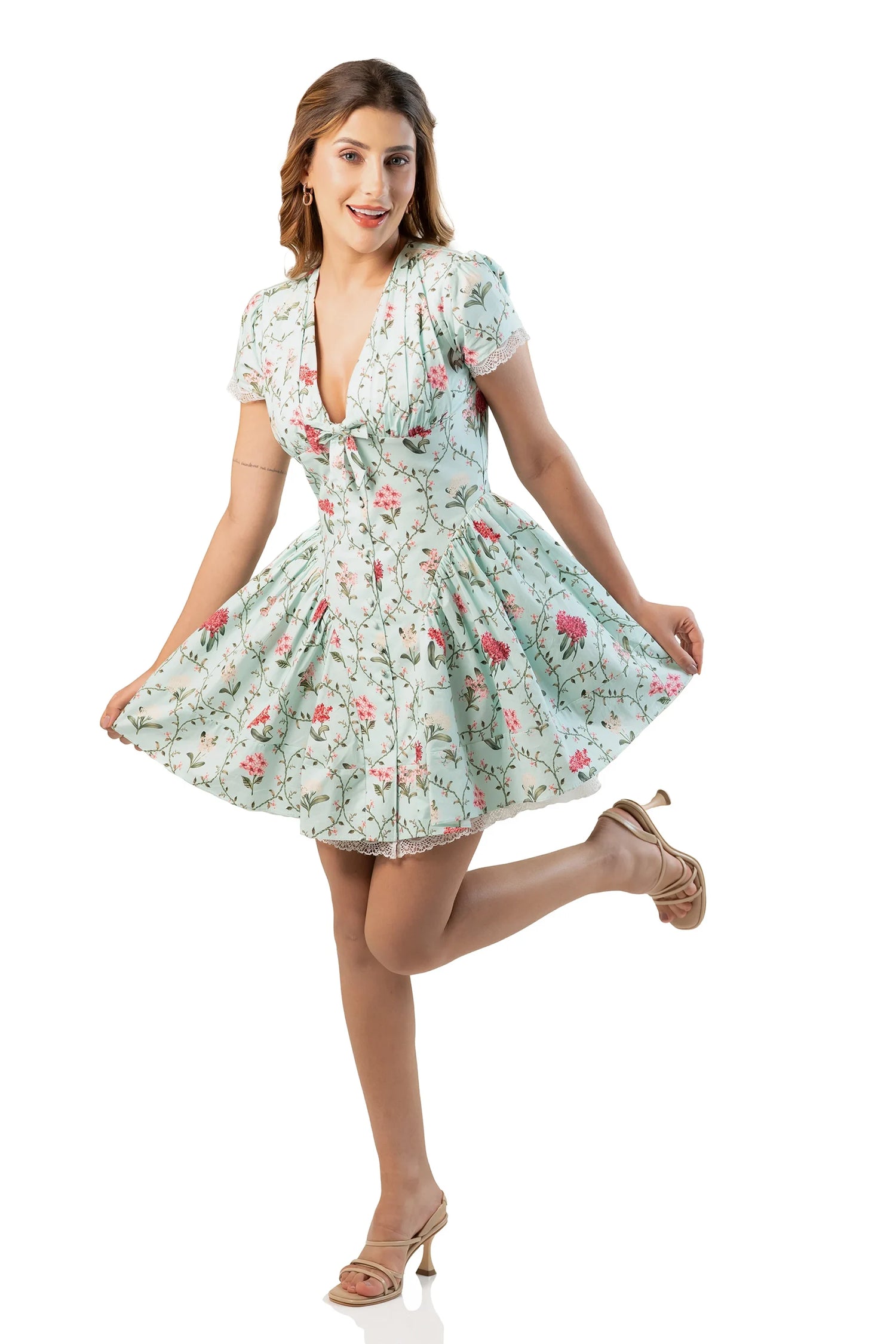 Front view: mint floral V-neck mini dress with tie-front and lace-trim hem
