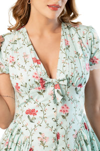 Mint floral short-sleeve mini dress close-up; V-neck with tie and buttons