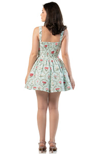 Full back view: mint floral smocked mini dress with wide straps