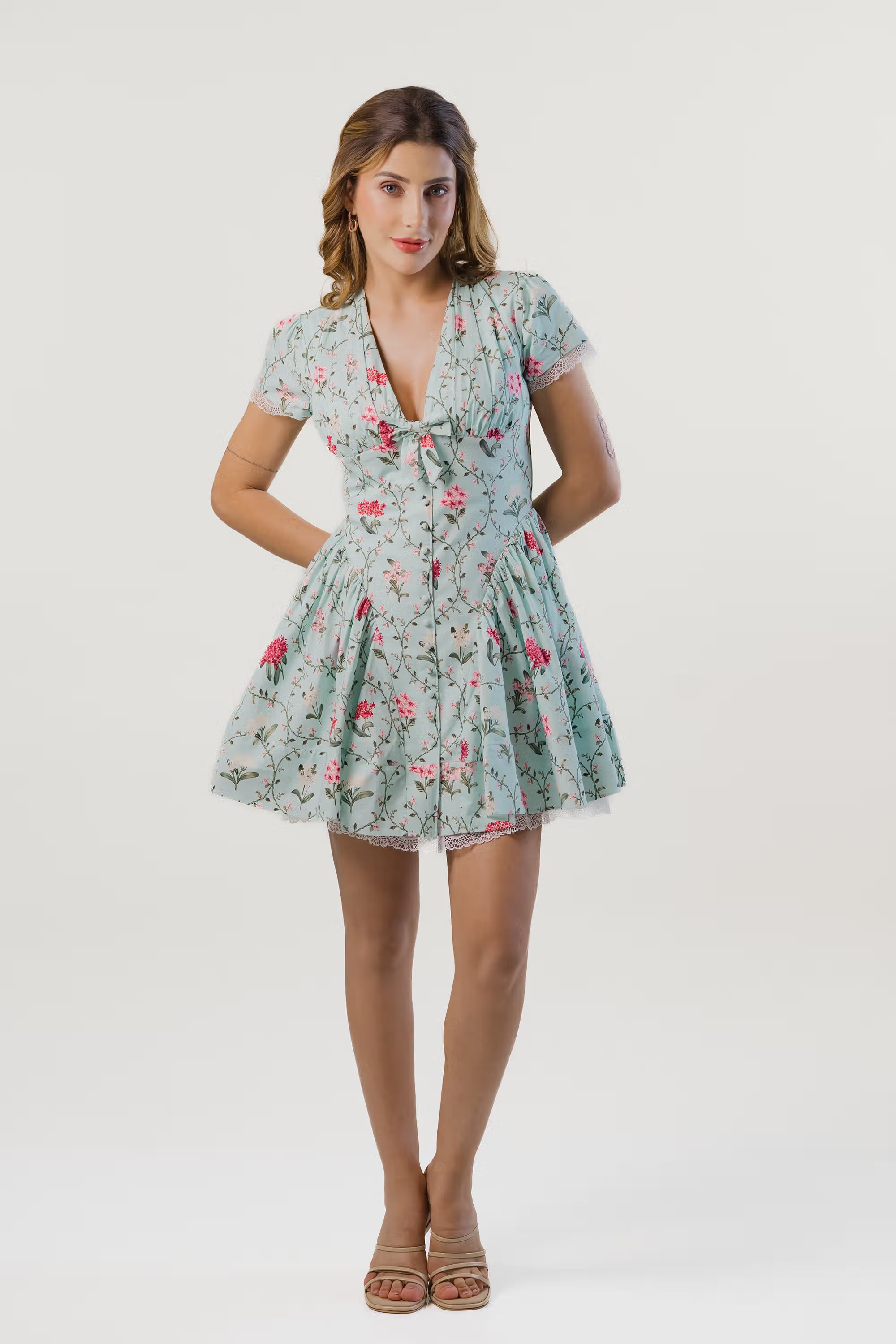 Front view of mint green short floral dress with lace hem and puff sleeves for women