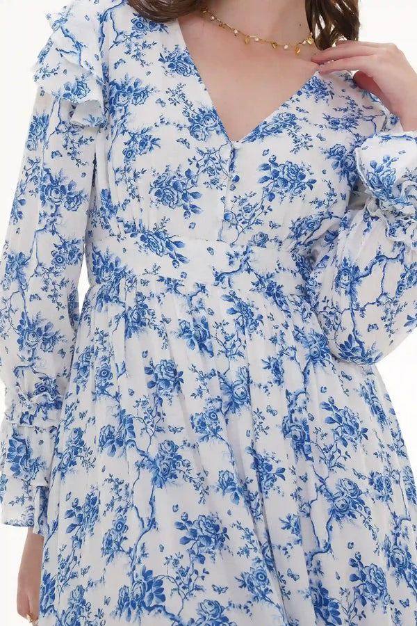 Close-up of Pretty Pixie navy floral belted puff-sleeve mini dress